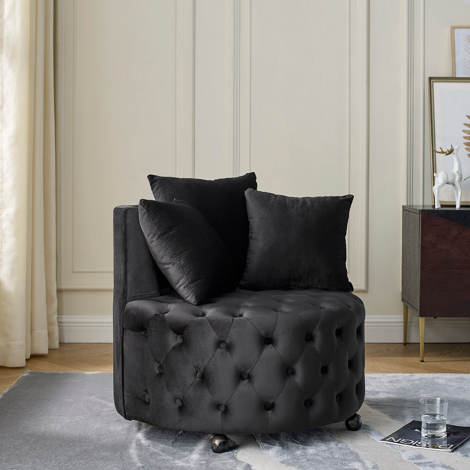 Black velvet upholstery close-up on tufted swivel chair