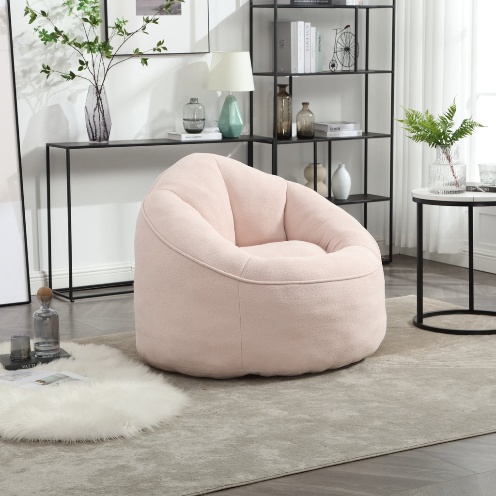 Pink bean bag lounge chair in bedroom or dorm setting