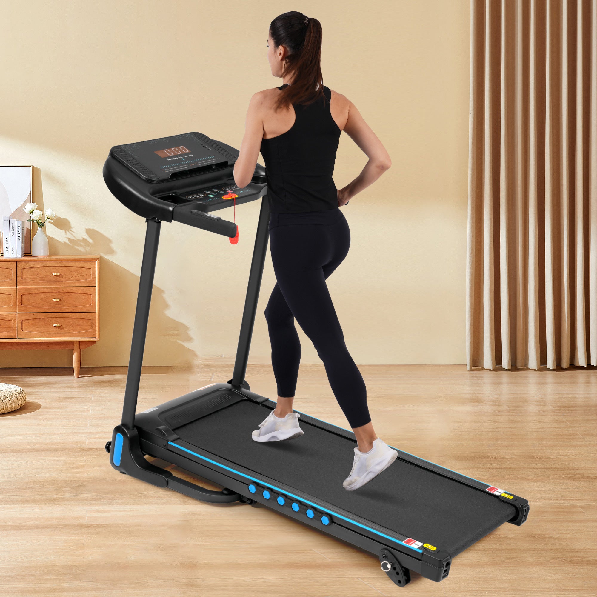 Black treadmill side profile showing foldable frame