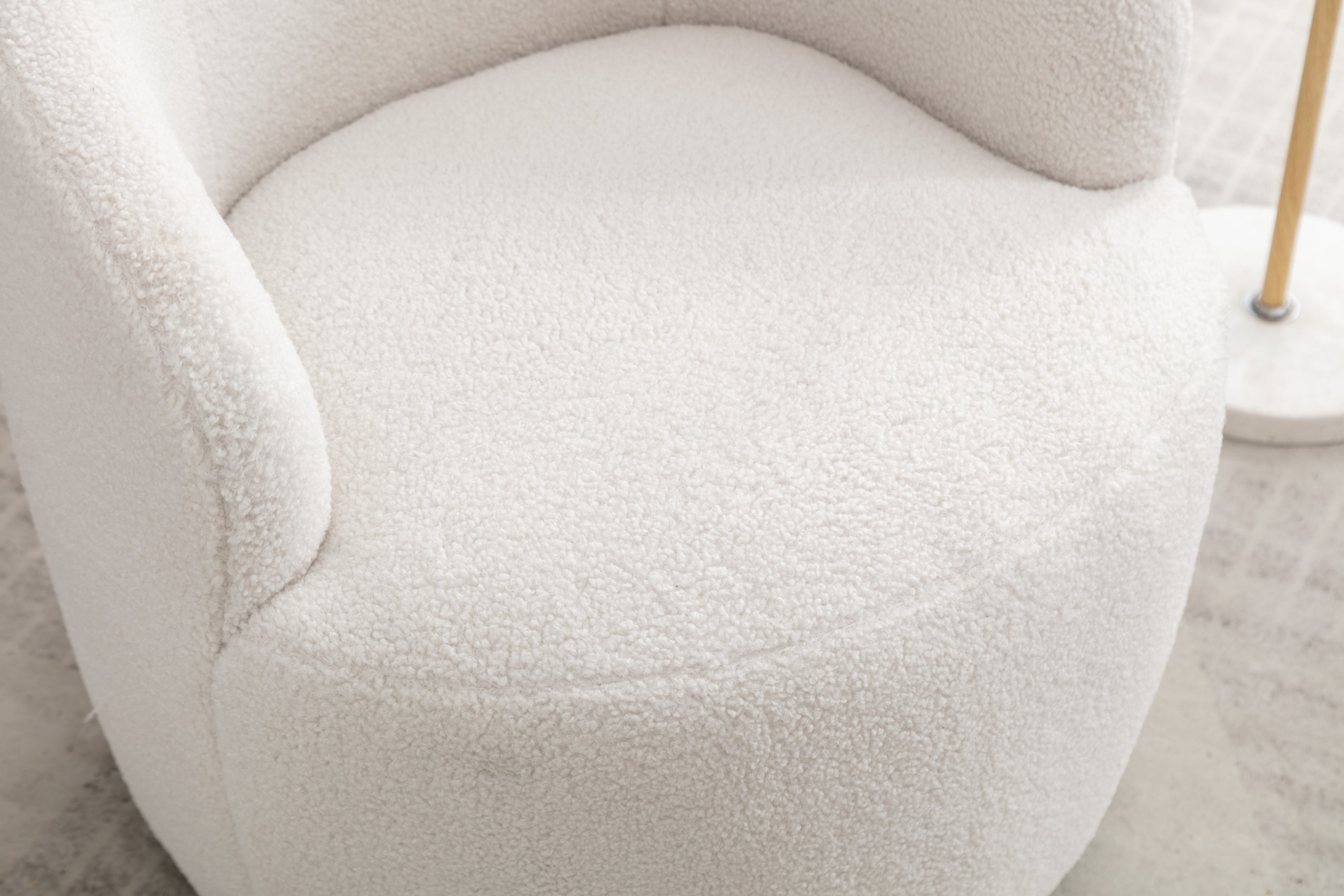 Ivory accent chair in living room setting