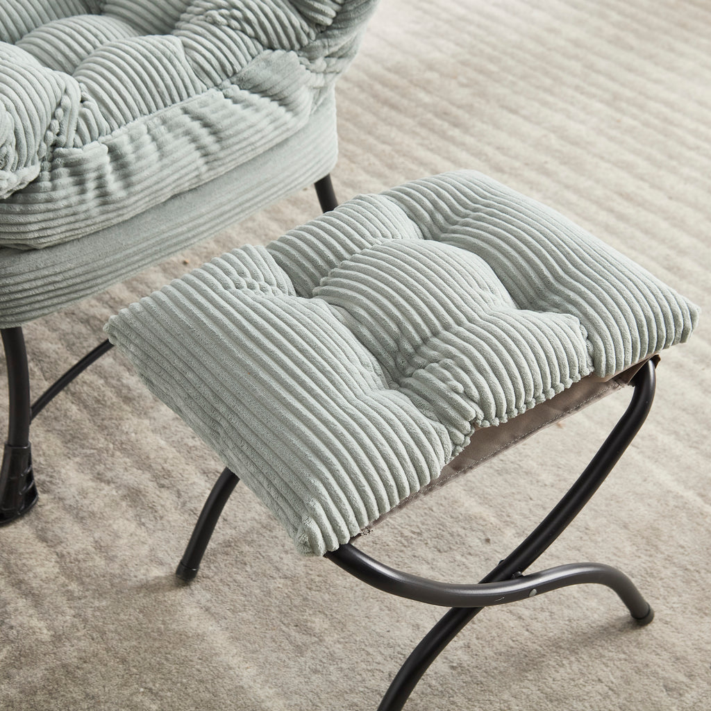 Lounge chair and ottoman in bedroom corner
