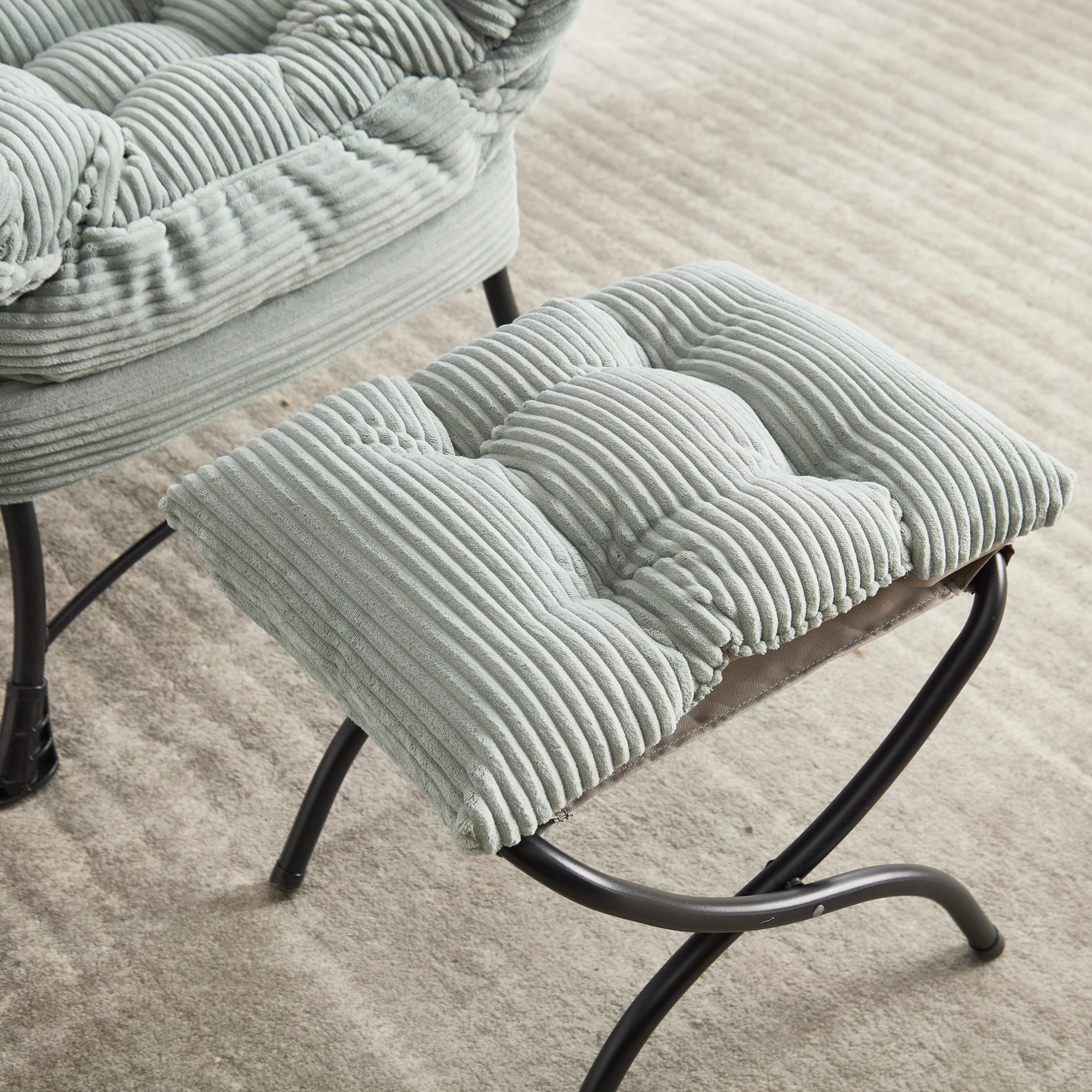 Lounge chair and ottoman in bedroom corner