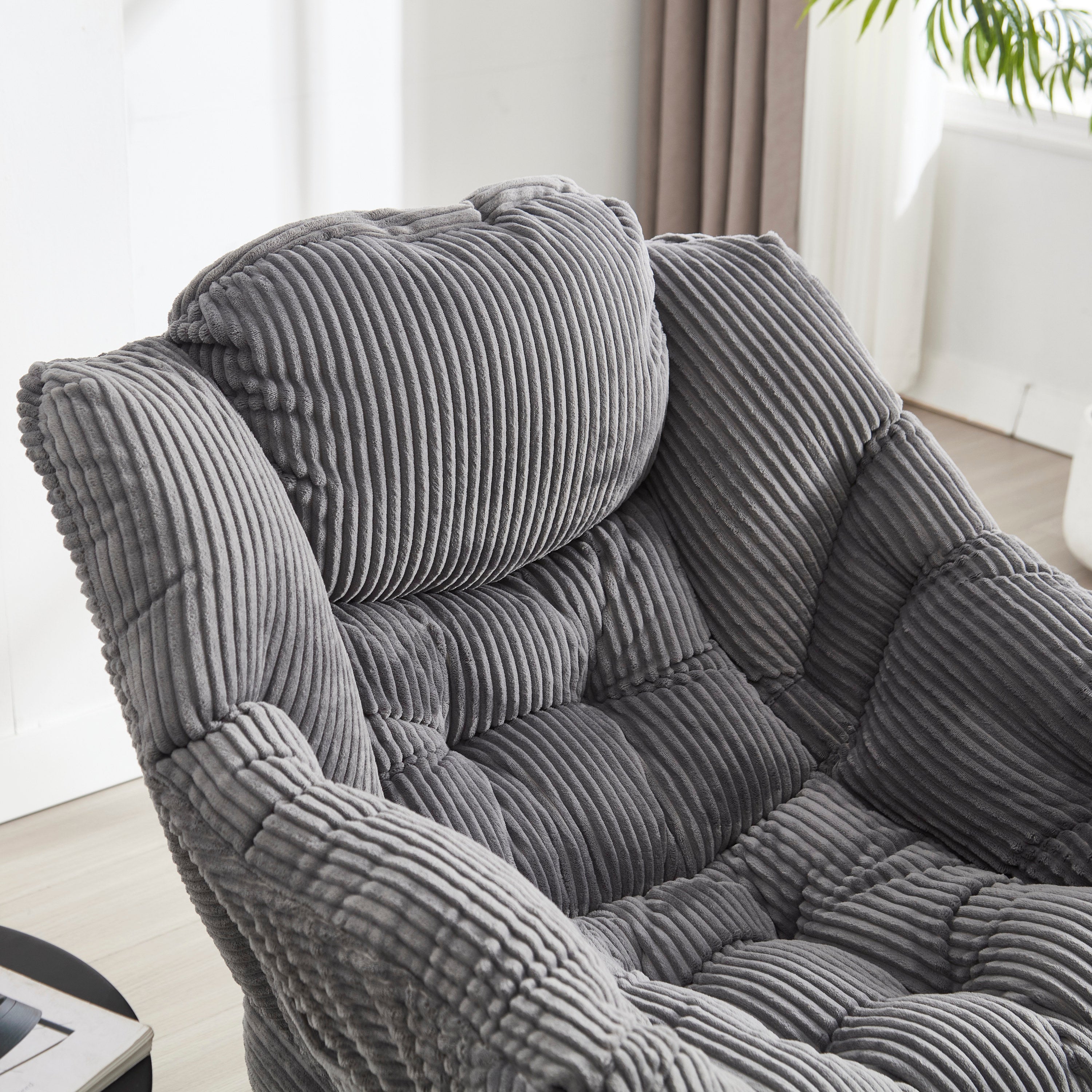 Gray lazy lounge chair ergonomic curved backrest detail