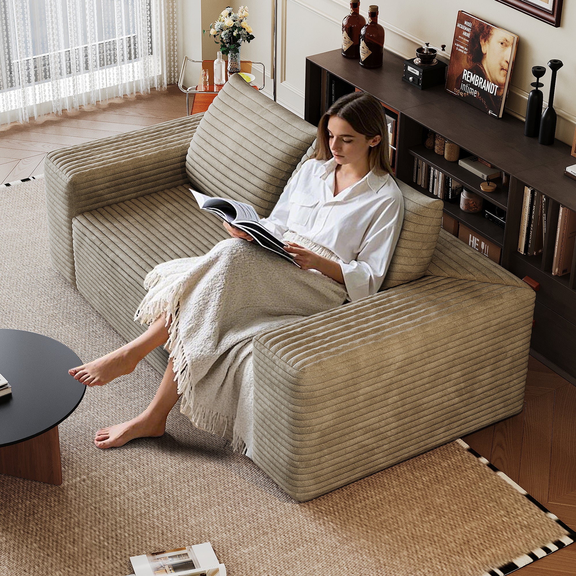 Camel corduroy 2-seater sofa in living room setting