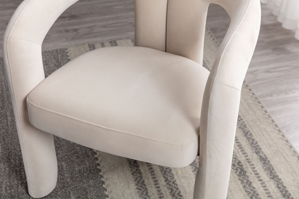 Beige velvet accent chair back view