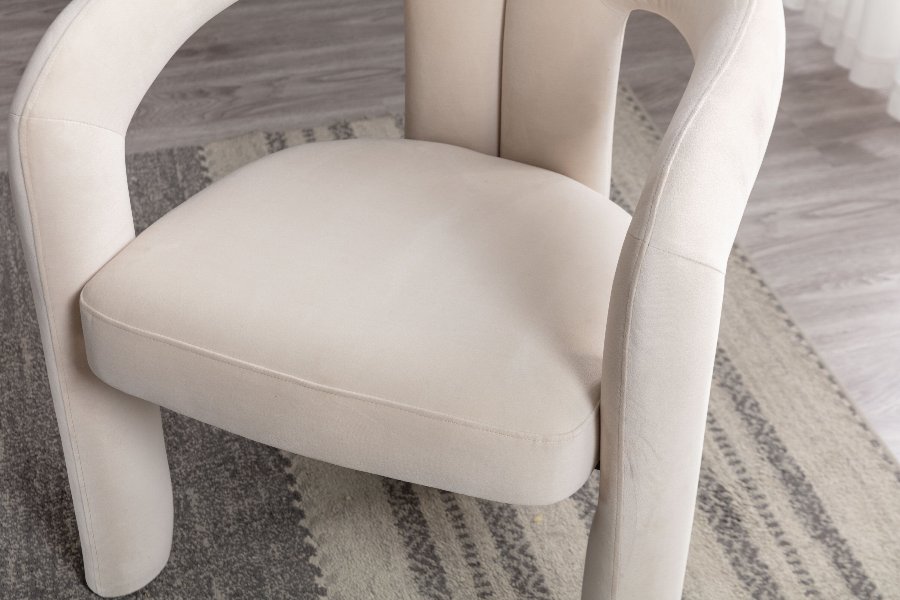 Beige velvet accent chair back view