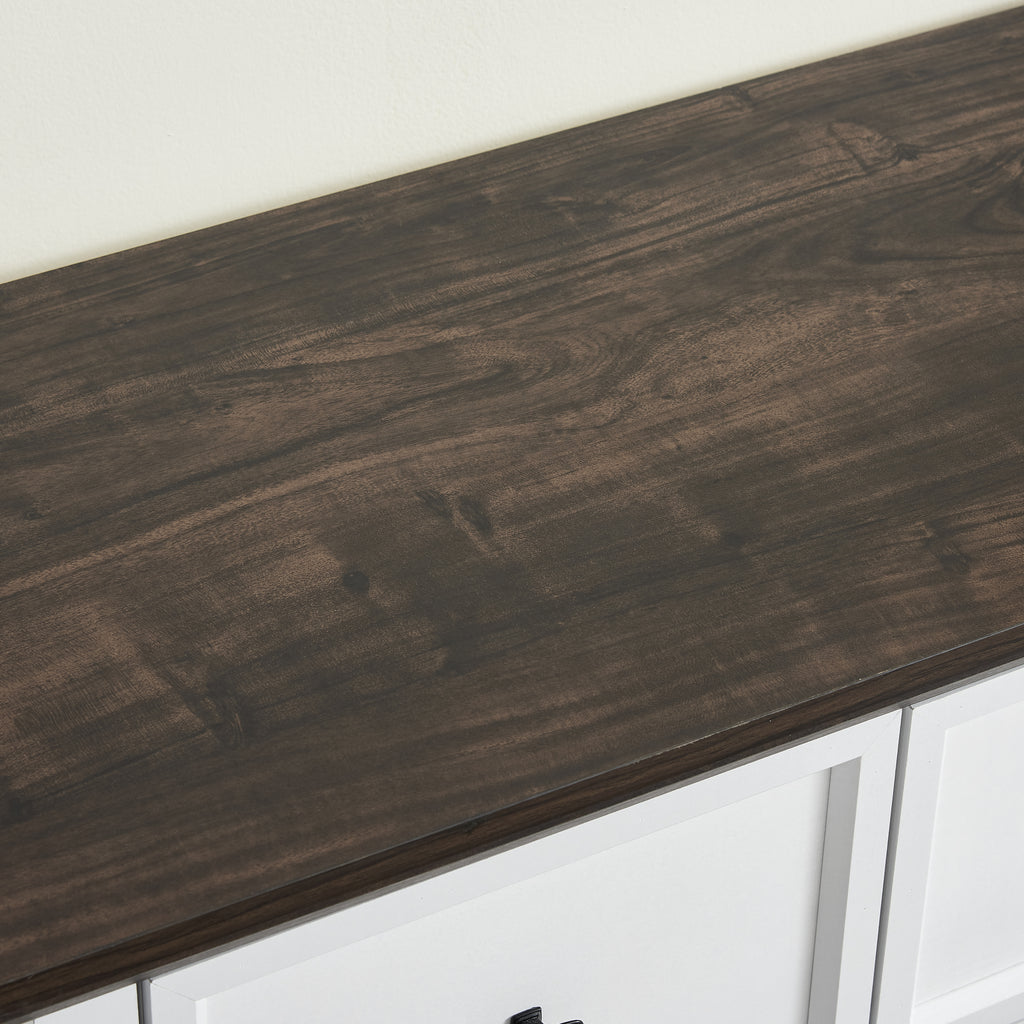 Black grain finish detail on white farmhouse dresser