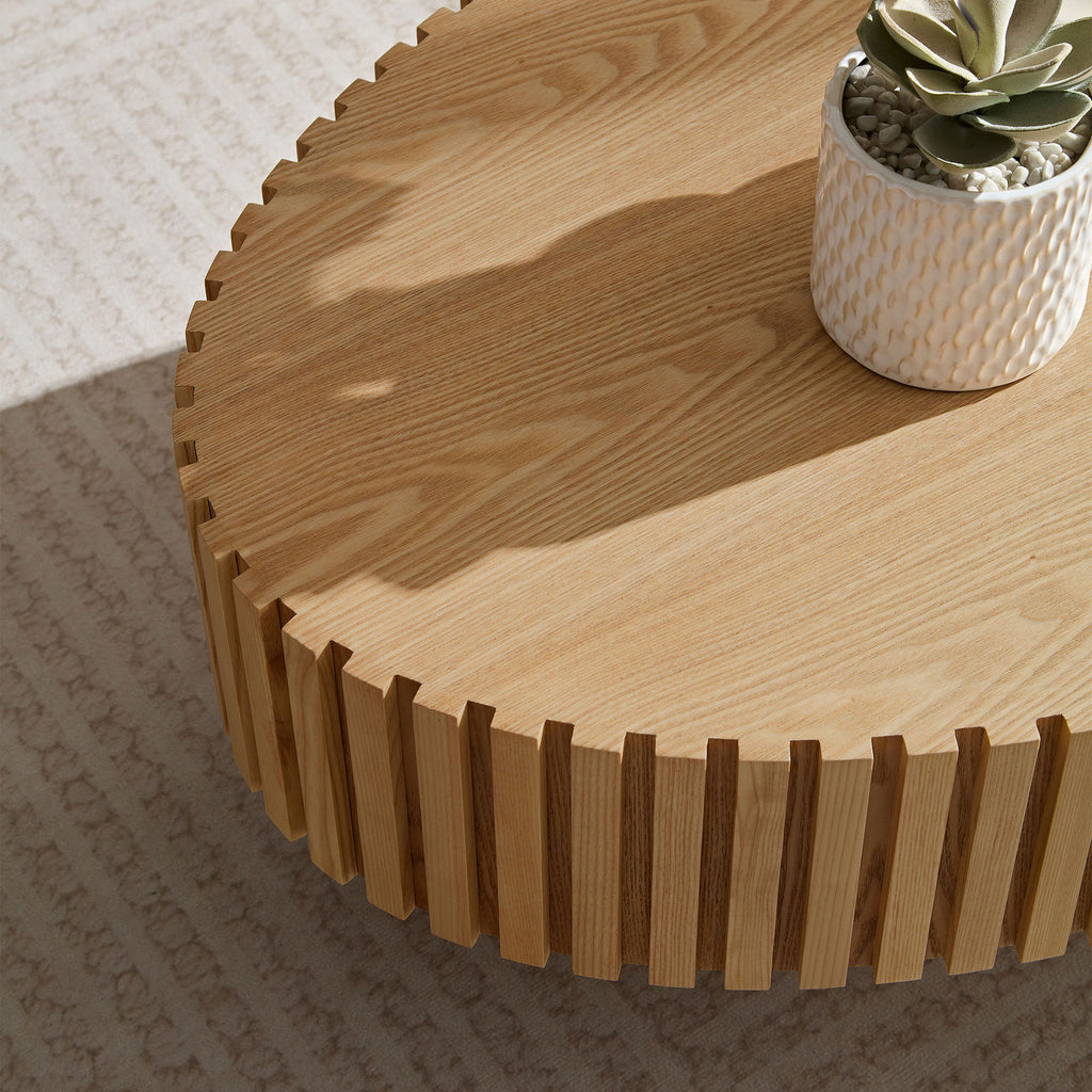 Natural ash drum table in bedroom setting