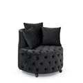 Black velvet tufted swivel accent chair with wheels — front view
