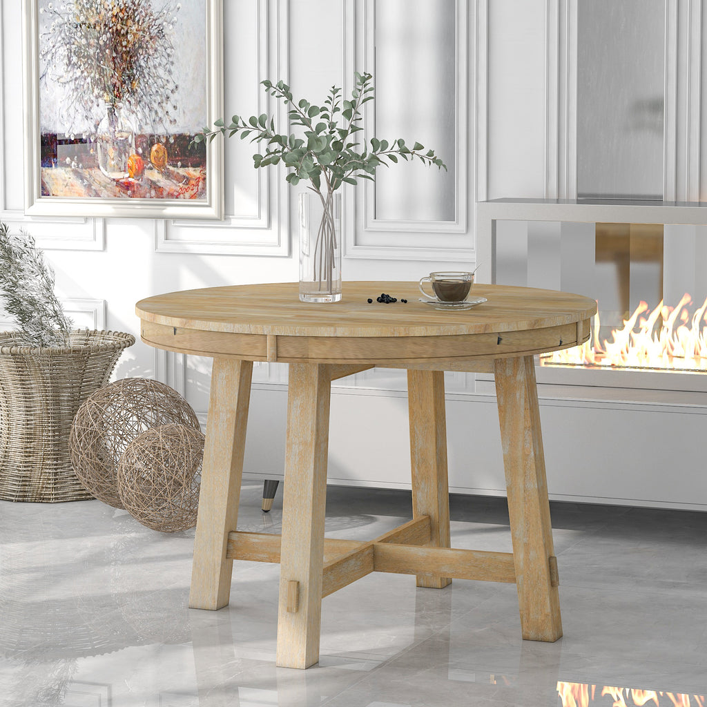 Round dining table X-shaped base natural wood legs detail