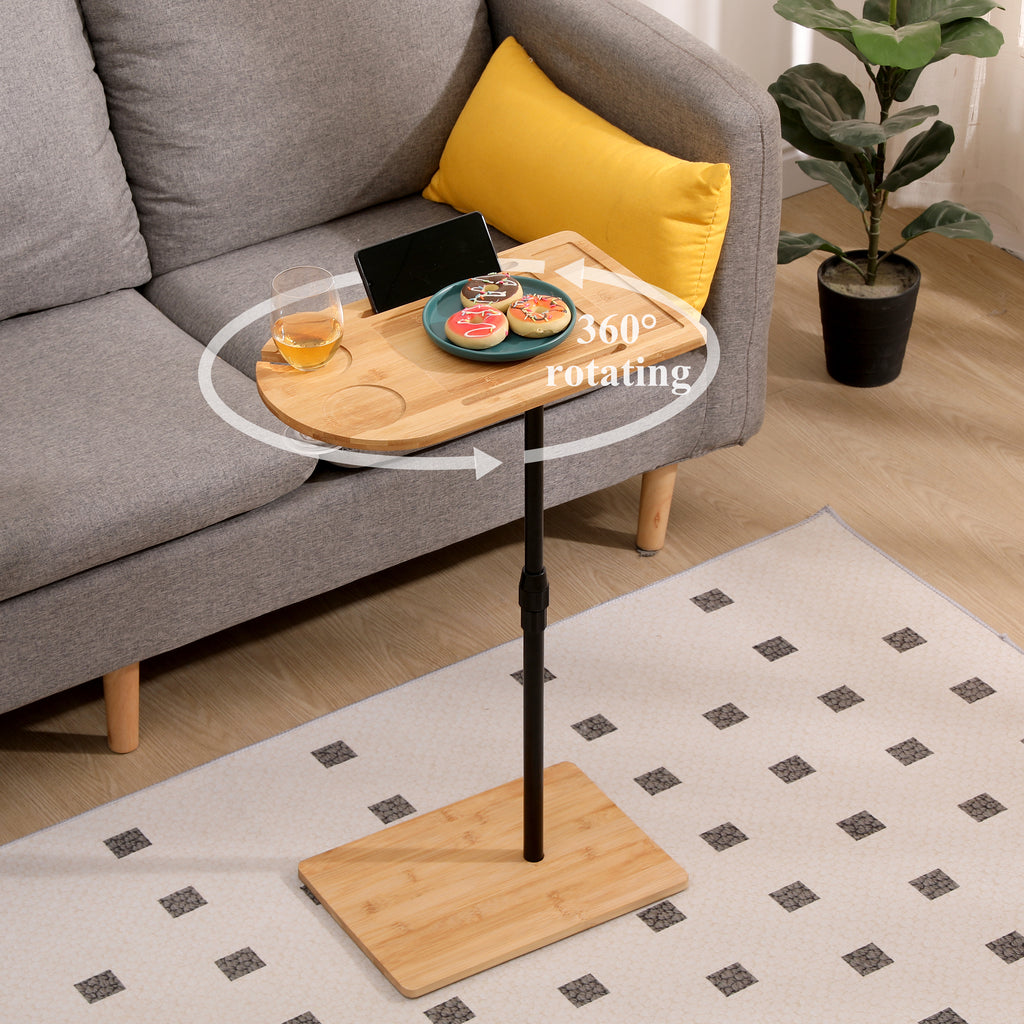 Natural bamboo C-shaped side table beside sofa in living room
