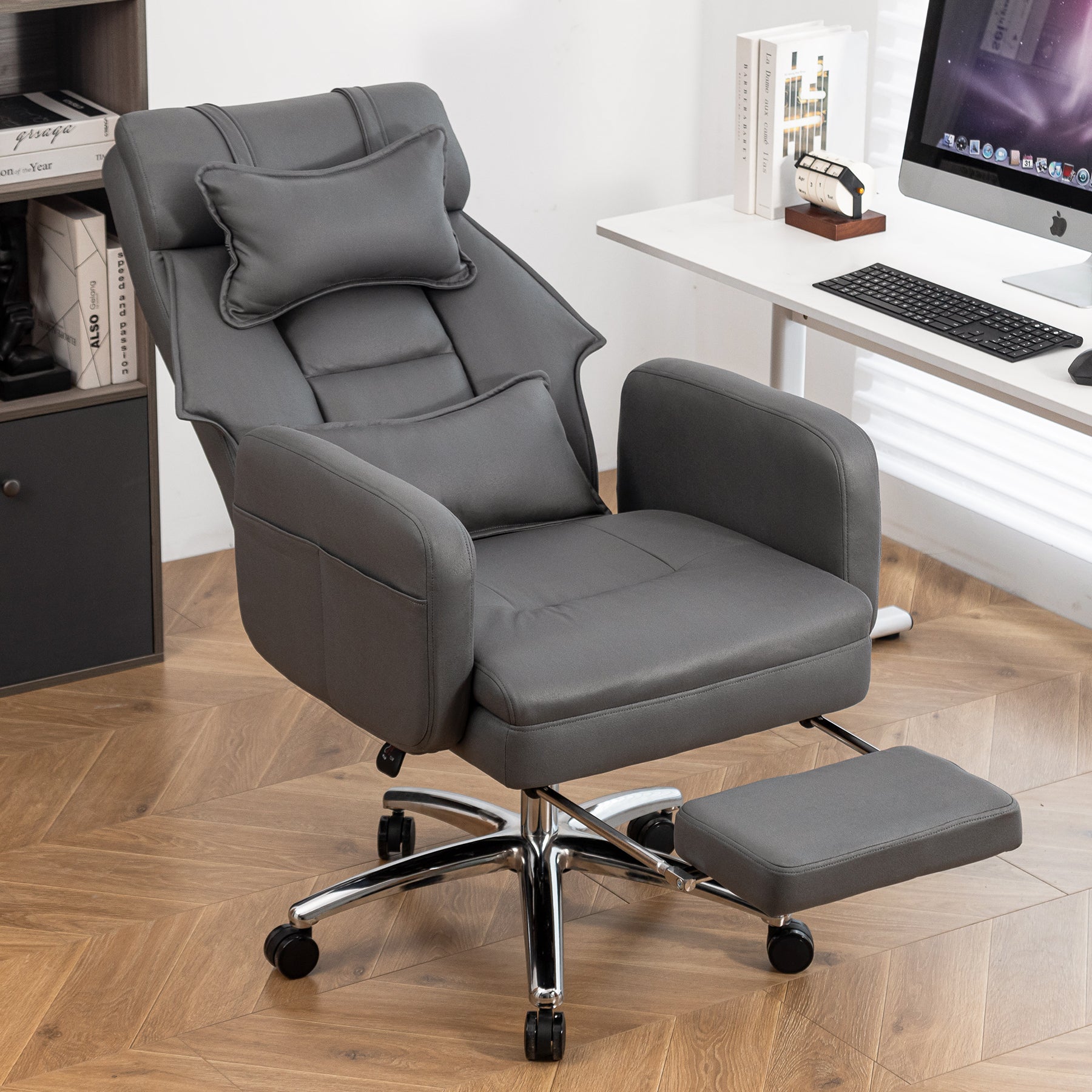 Dark grey boss chair in home office setting