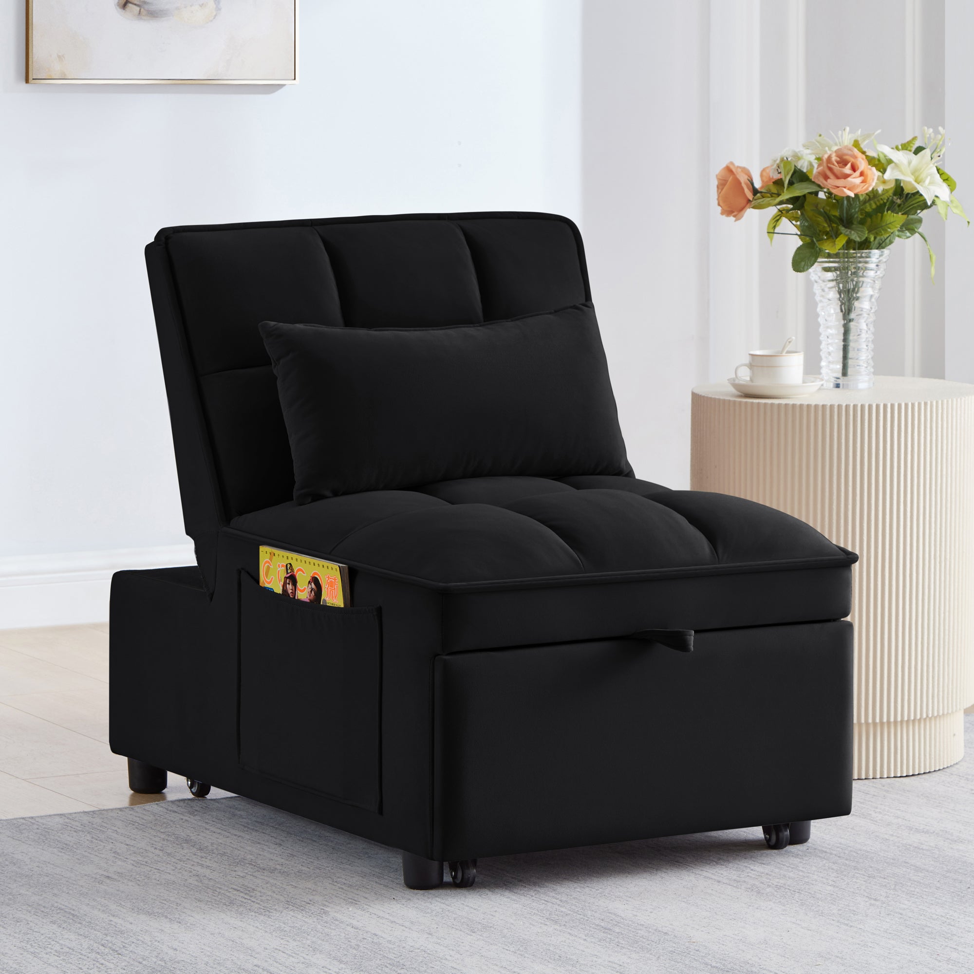 Black tufted pull-out sofa bed — angle view