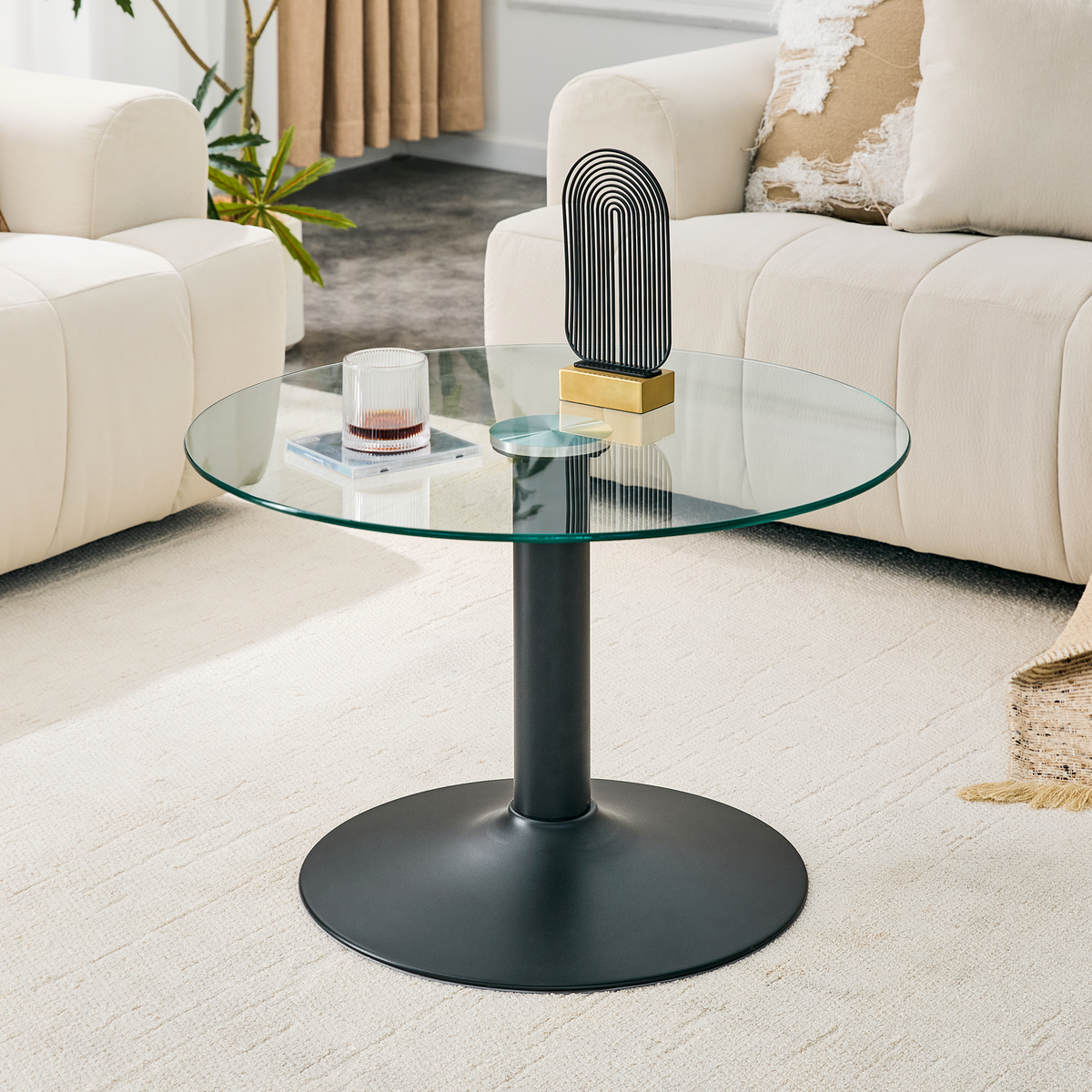 27.5-inch diameter round tempered glass coffee table. 17.7 inches high, supported by a black metal base, with a light luxury edge.