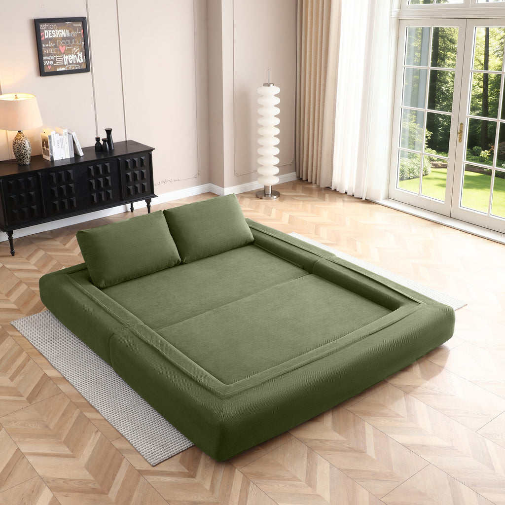 Included pillows detail on green corduroy couch