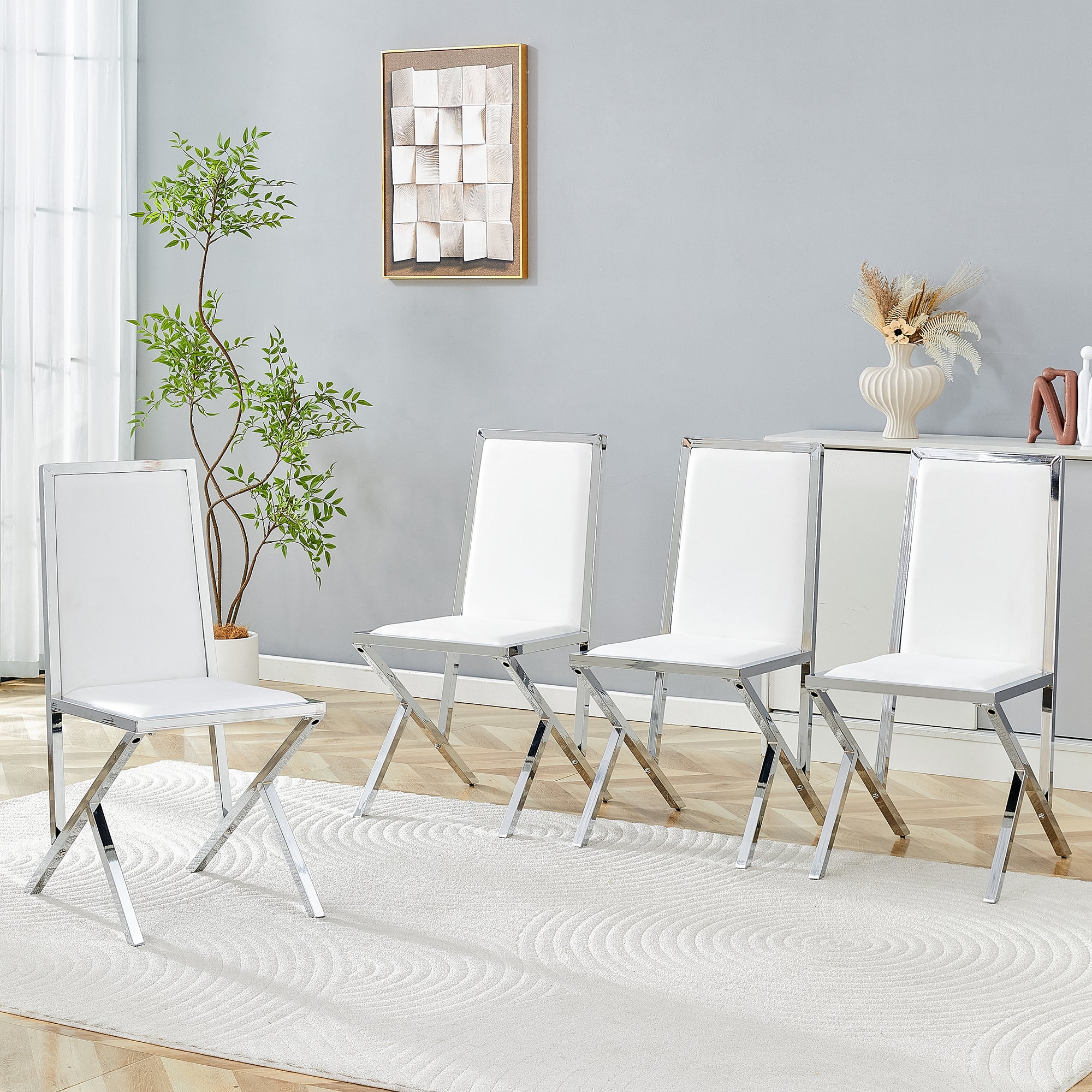 4-pack silver metal framed white PU dining chairs: ergonomic design, a simple and luxurious choice.Featuring uniquely designed silver metal legs.