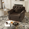 Brown velvet Chesterfield single-seat sofa — front view