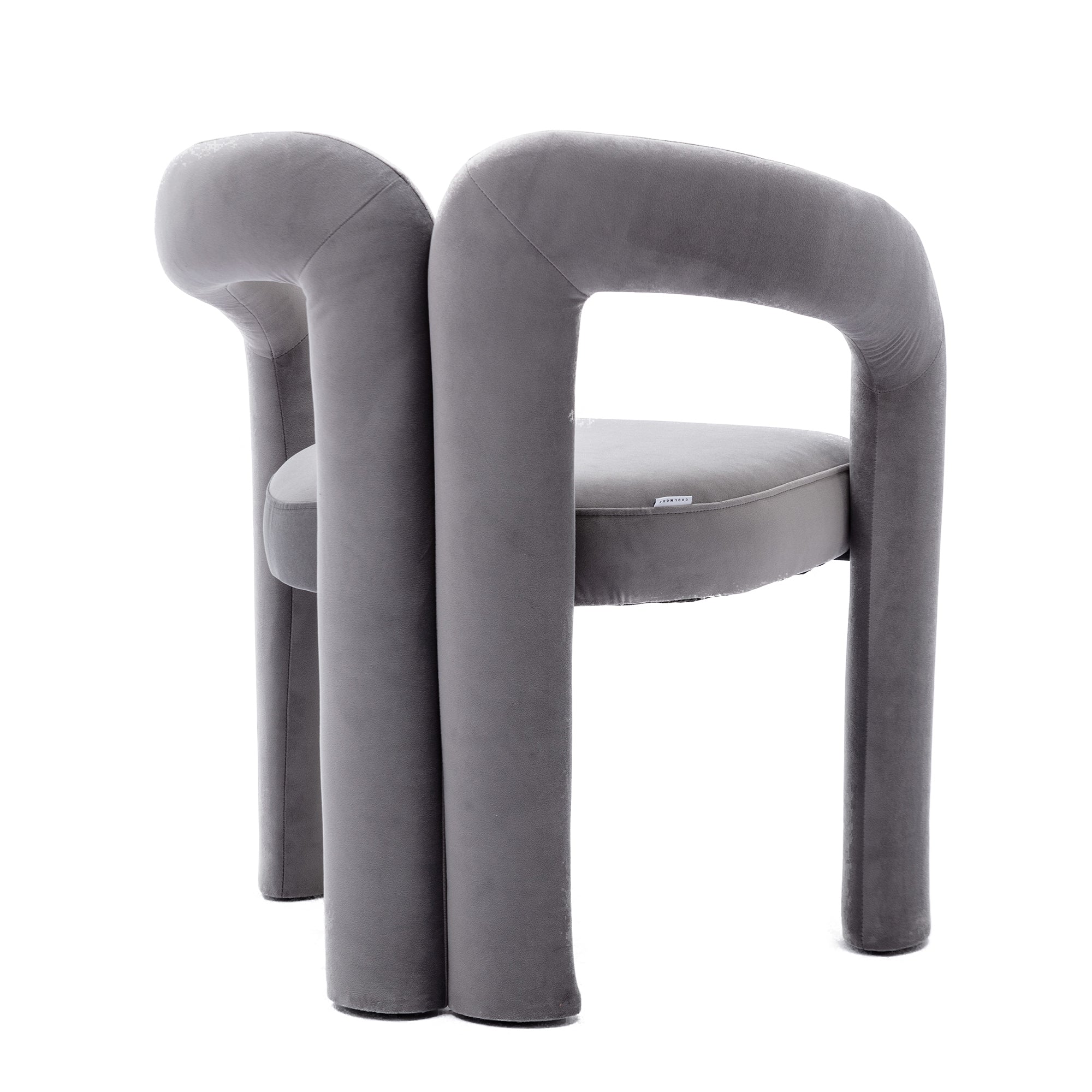 Two gray velvet dining chairs styled at dining table