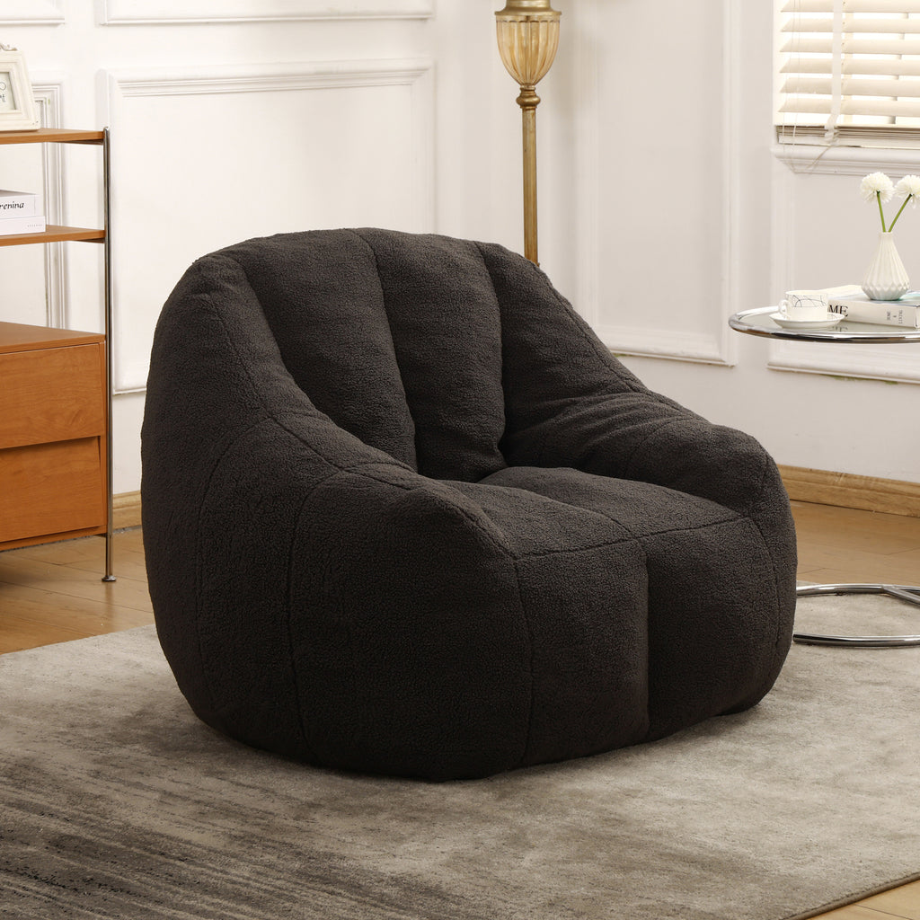 Dark gray tufted bean bag sofa chair — angle view