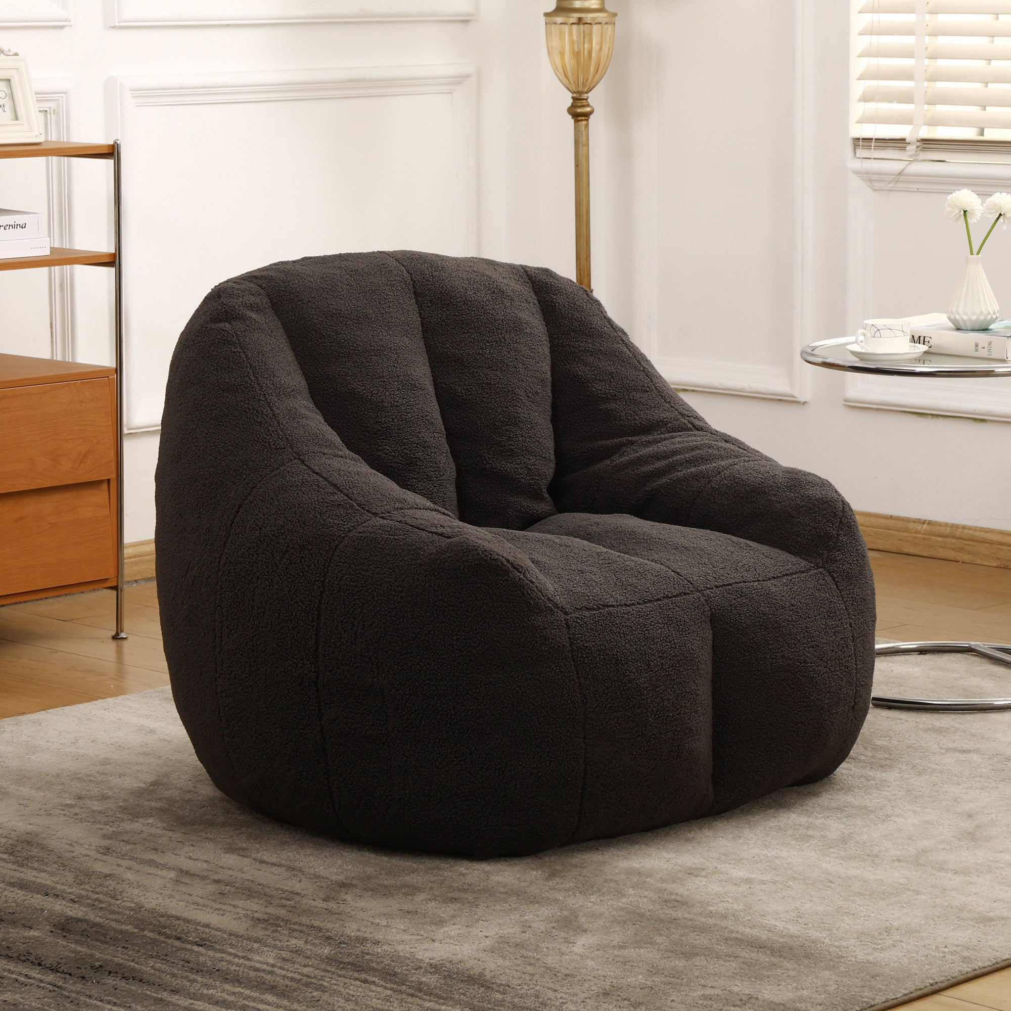 Dark gray tufted bean bag sofa chair — angle view