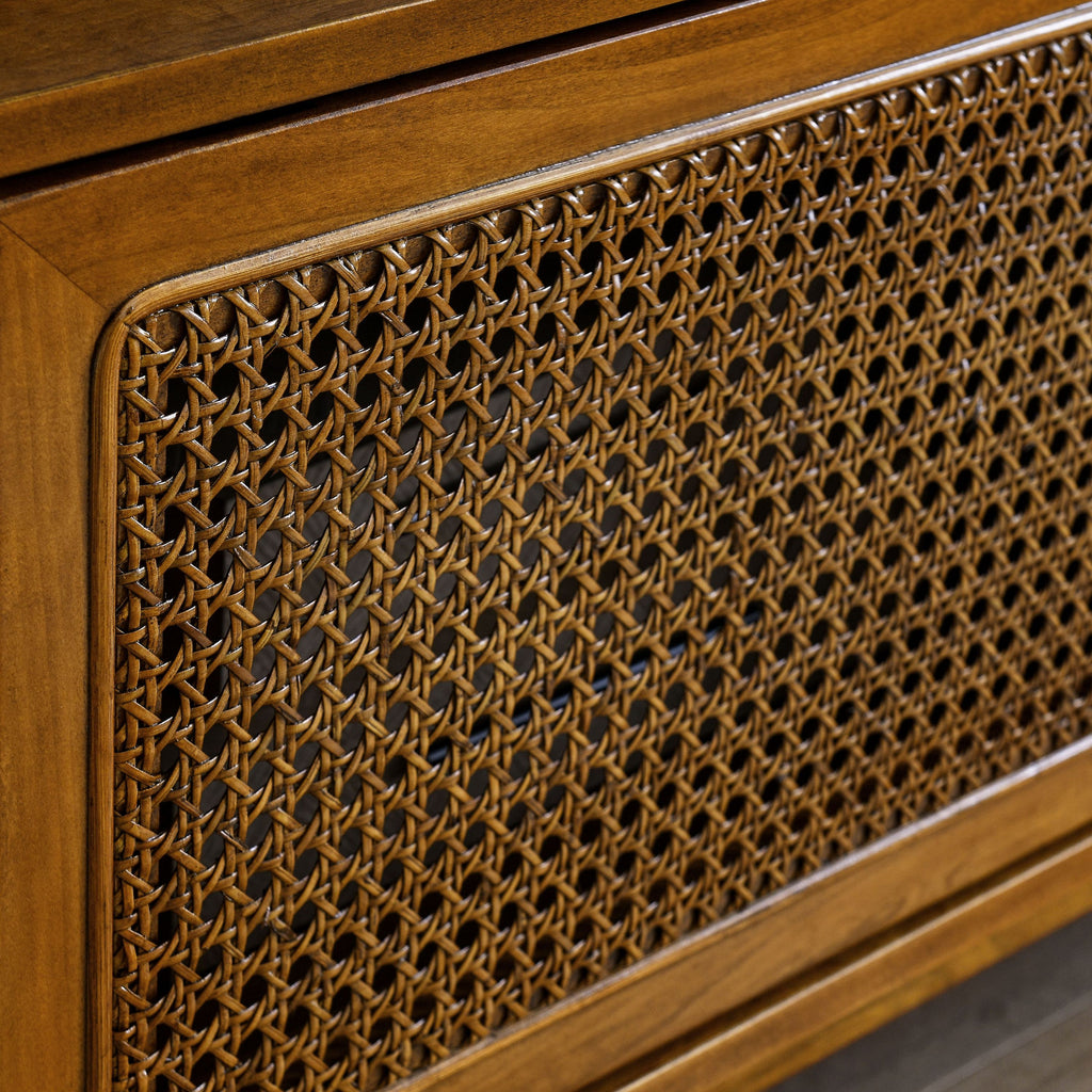 Mid-century rattan TV stand in living room setting