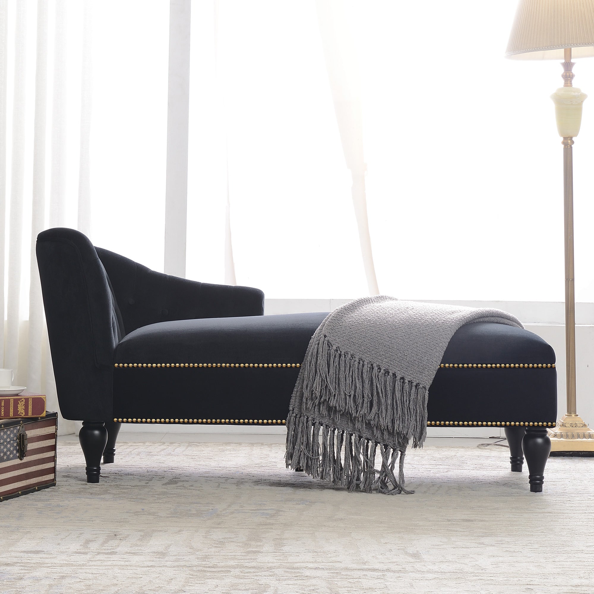 Solid wood leg detail on black chaise lounge