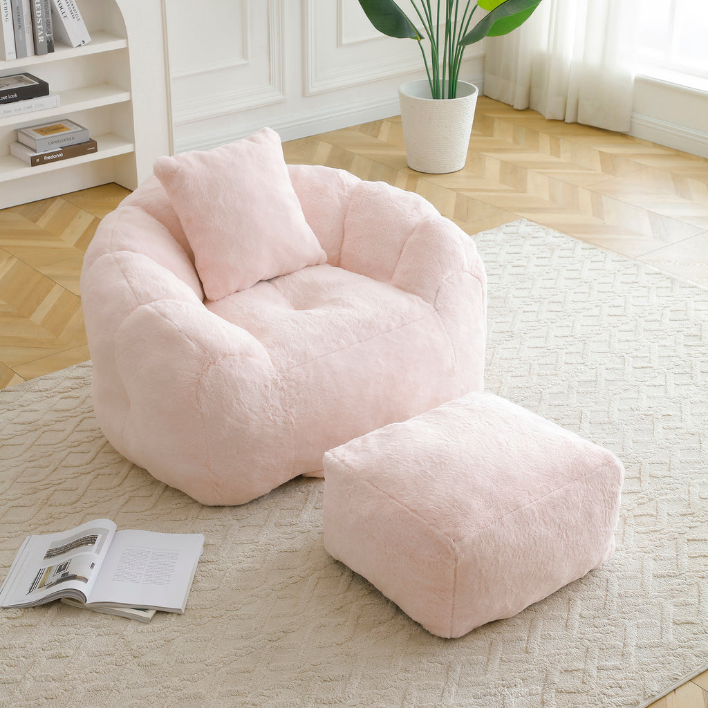 Pink shell bean bag chair with footstool — angle view