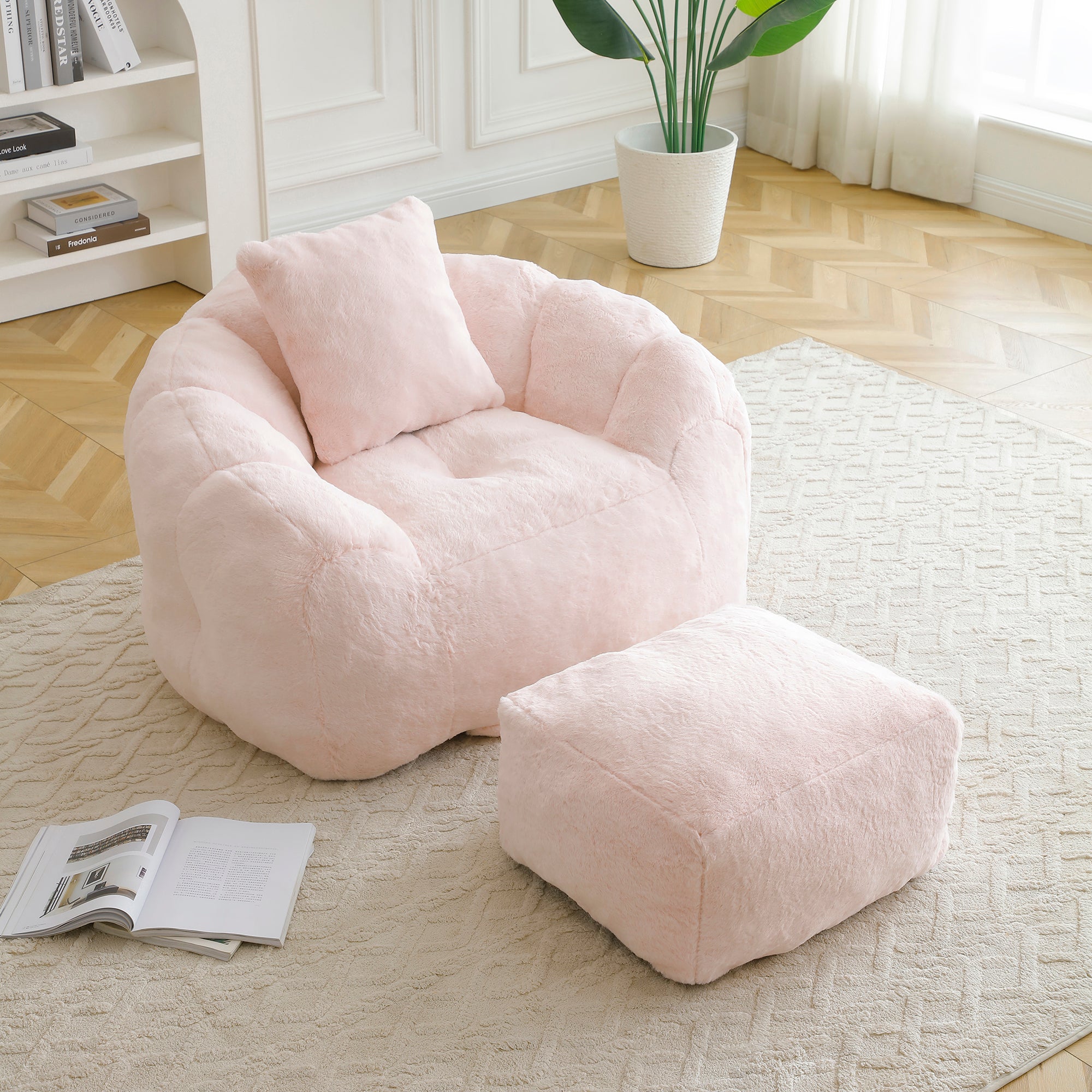 Pink shell bean bag chair with footstool — angle view