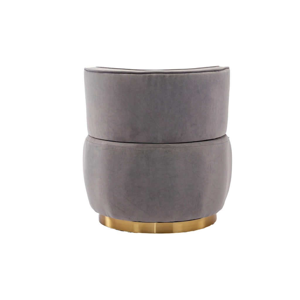 Gray velvet swivel chair in nursery or reading nook