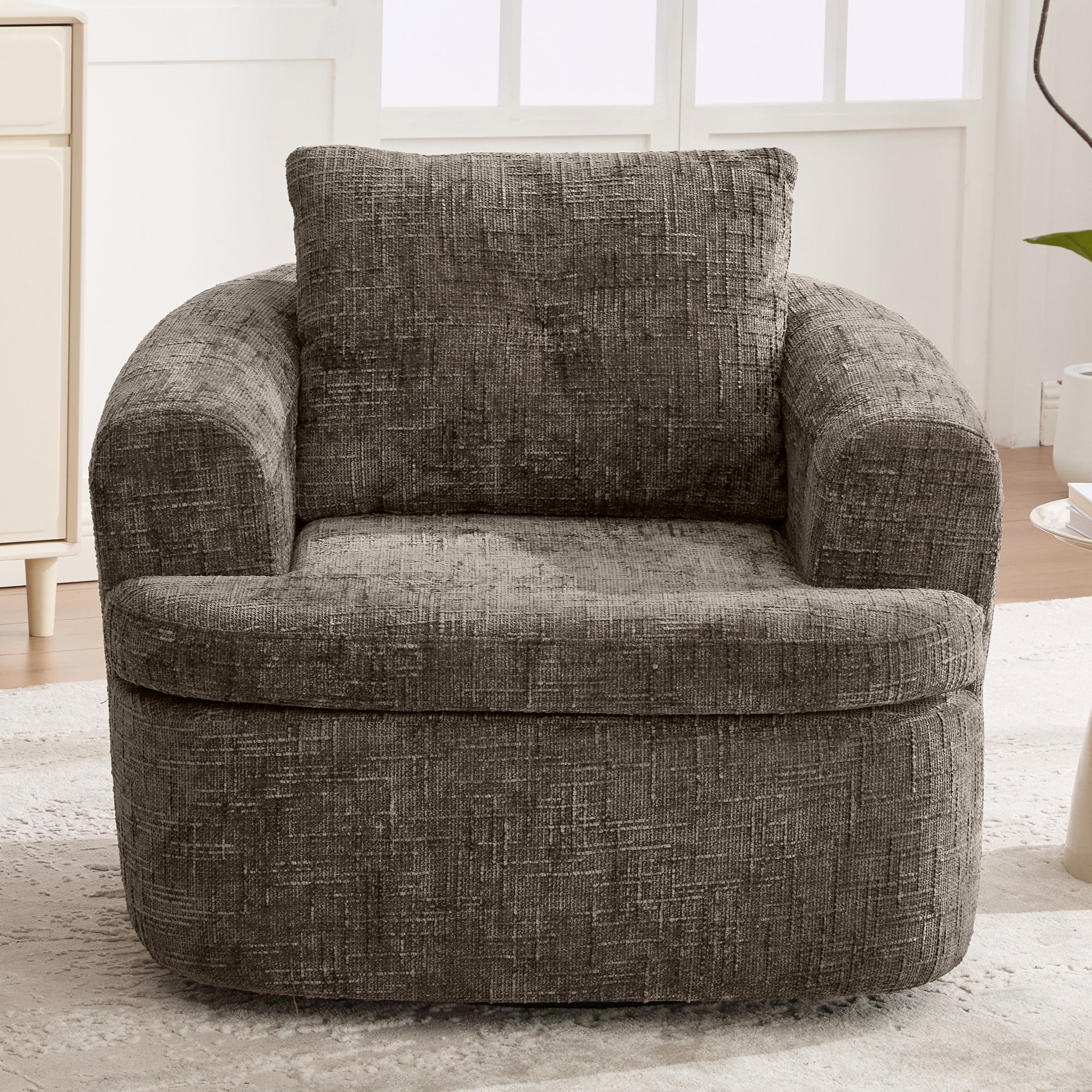 Swivel barrel chair tufted back pillow detail