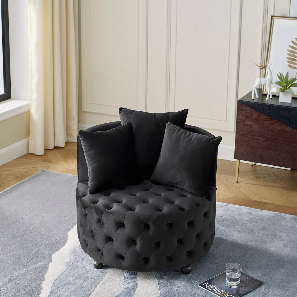 Black velvet tufted swivel chair 360-degree base detail