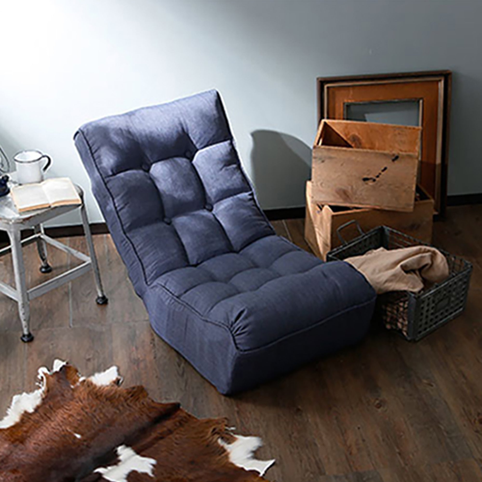 Navy floor reclining chair with adjustable back — angle view
