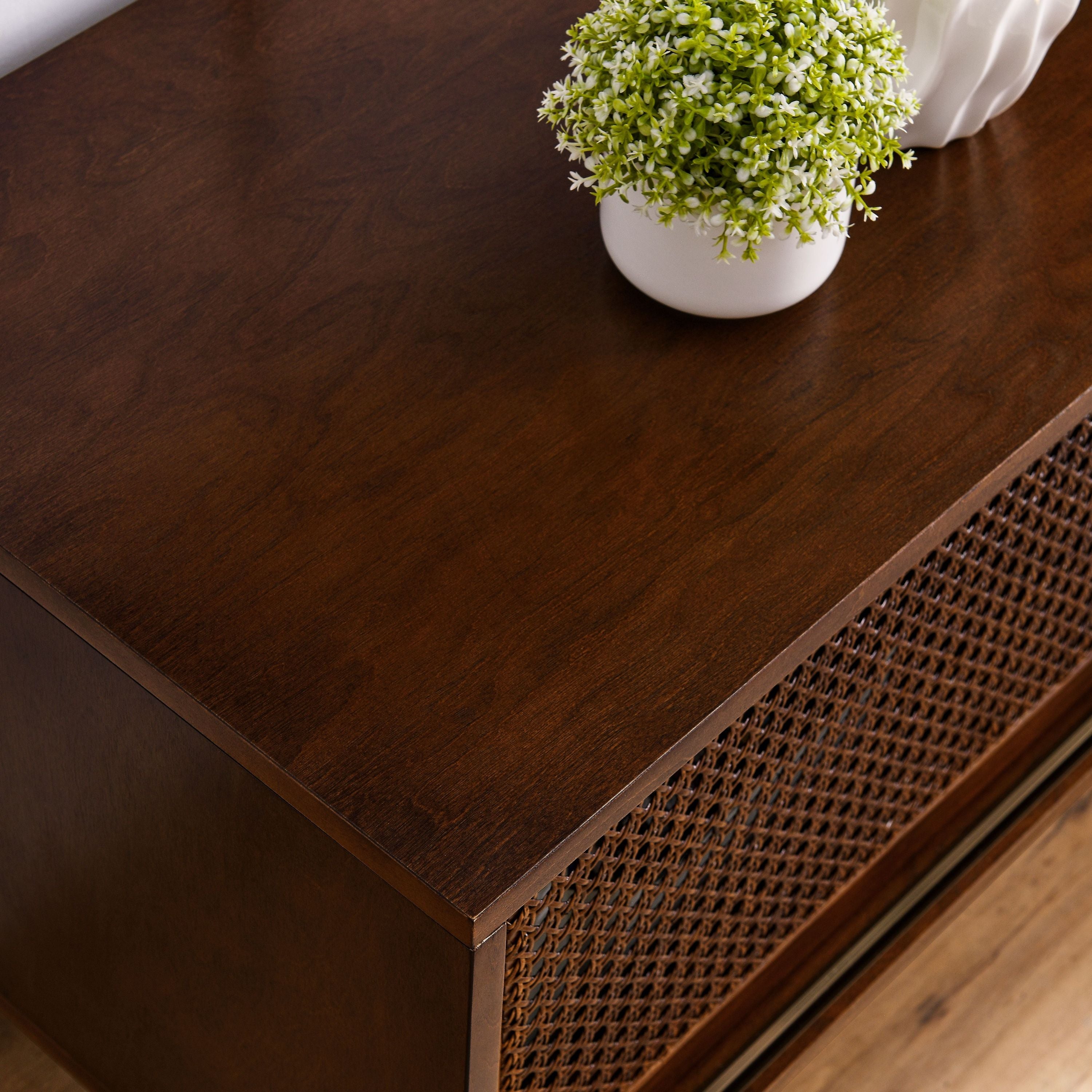 Walnut TV stand with open shelf storage detail