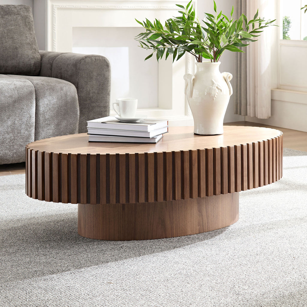 Walnut oval drum coffee table with pedestal base — front view