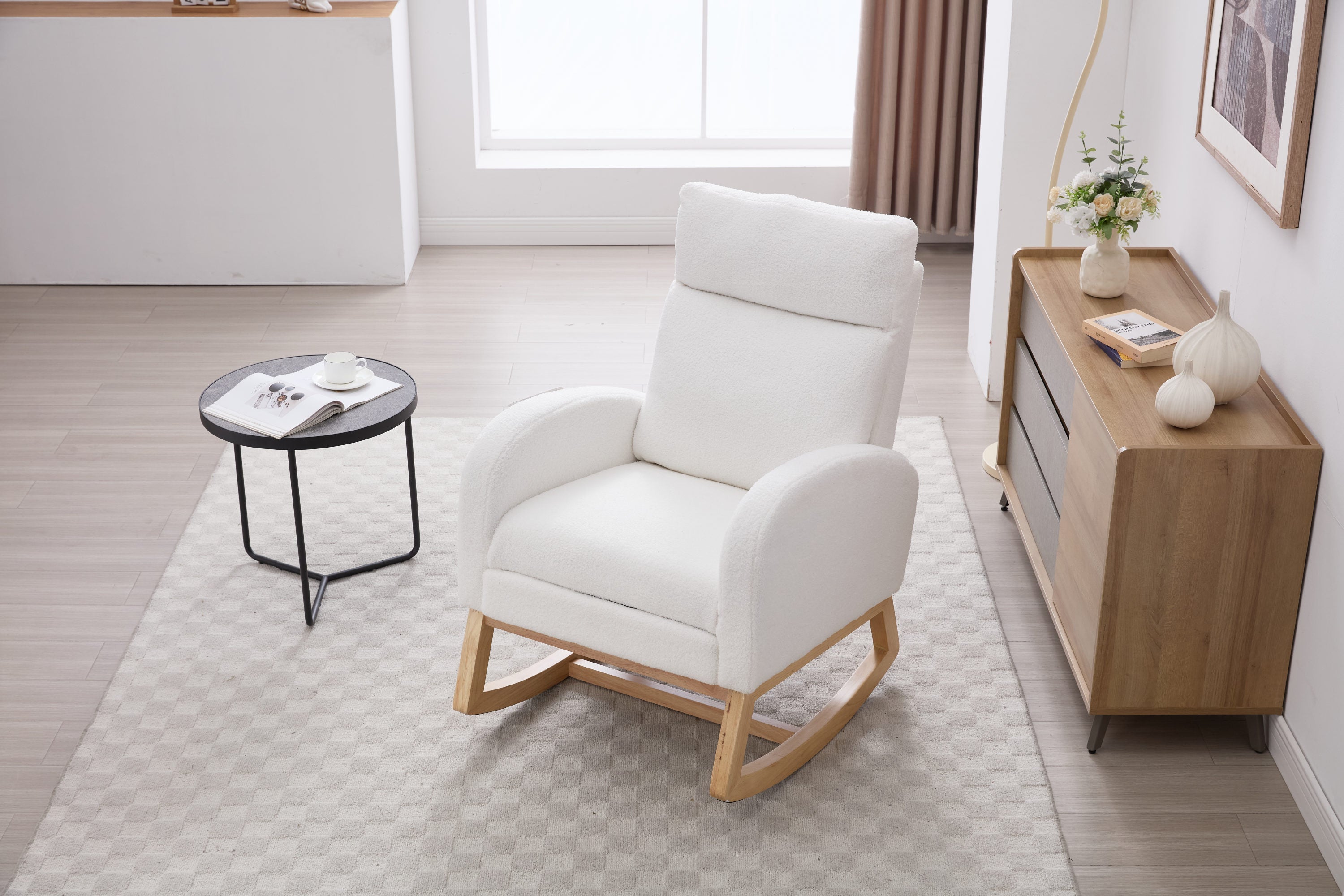 White rocking chair in baby room or nursery setting