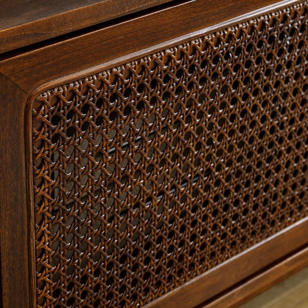 Mid-century rattan TV stand in living room setting