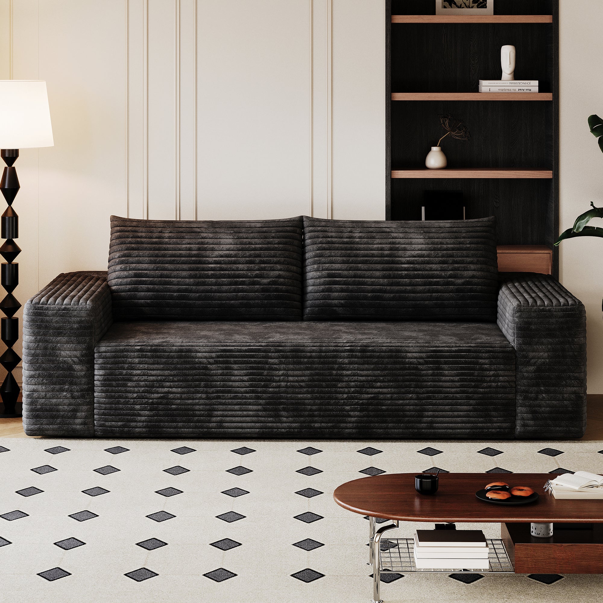 Black corduroy sofa seating area and cushions