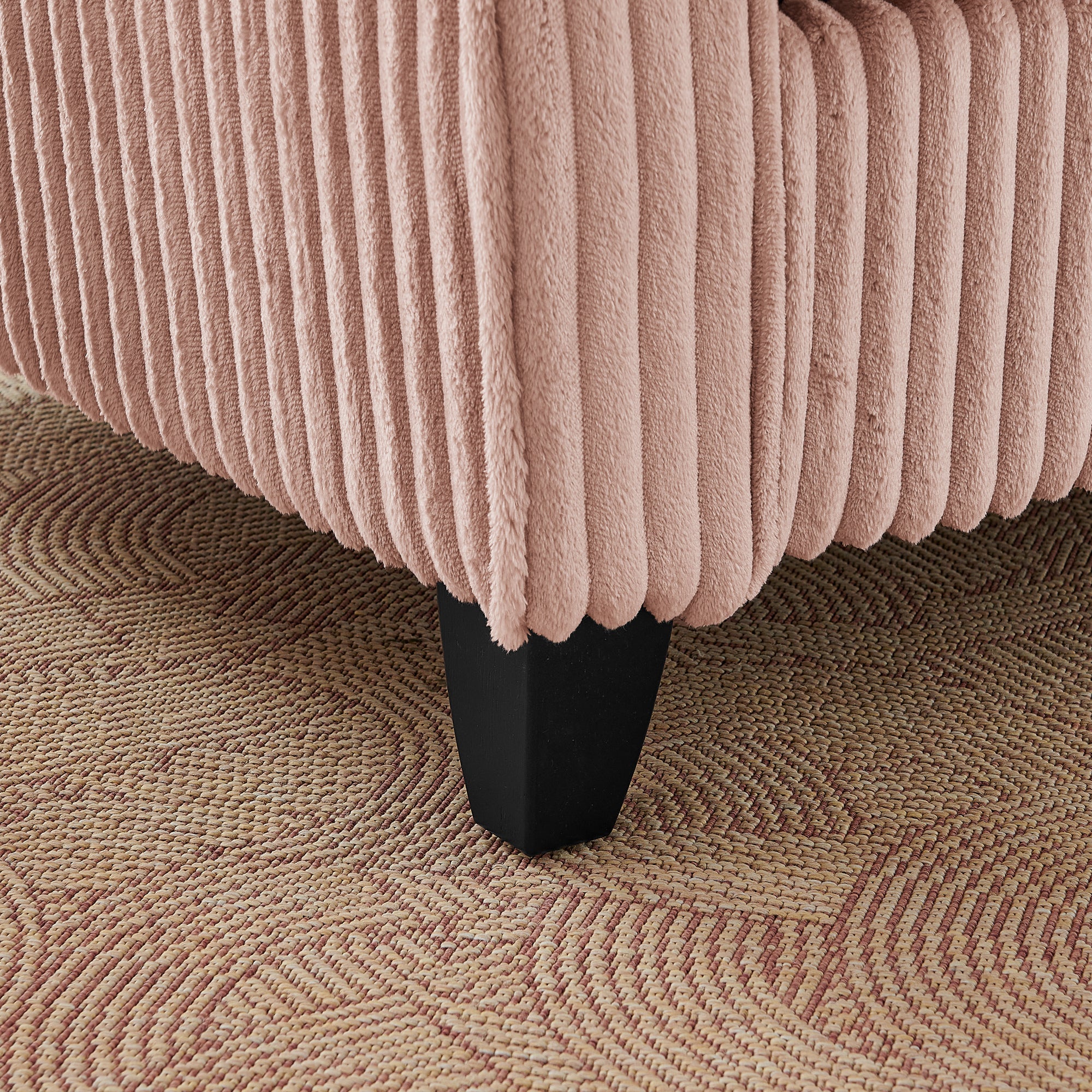Pink lounge chair in living room setting