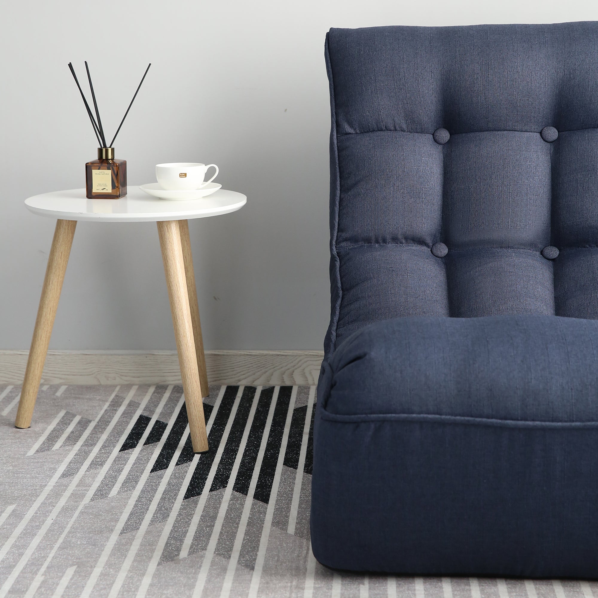 Navy linen floor chair compact dorm room setup