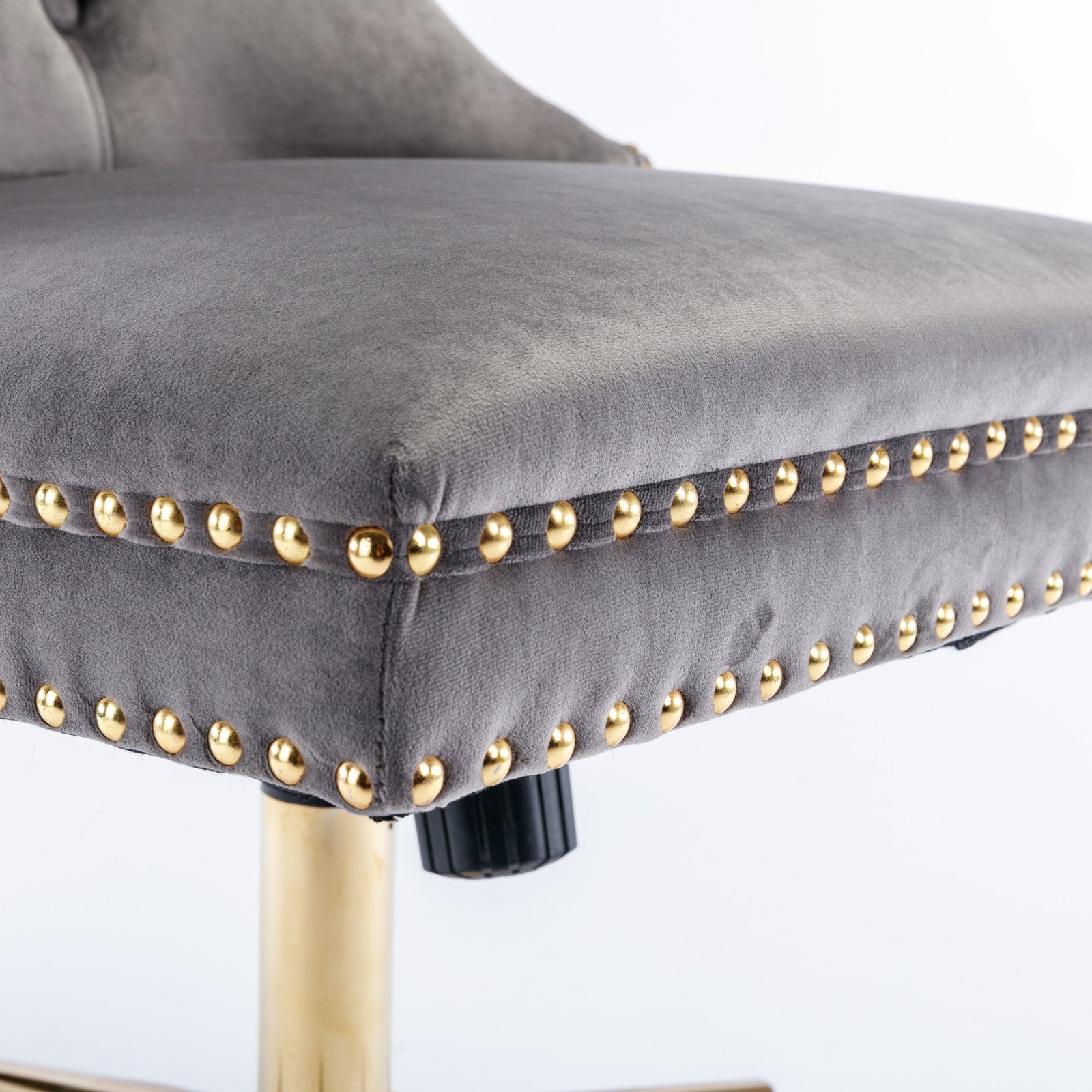 Desk chair gold metal base and wheel detail