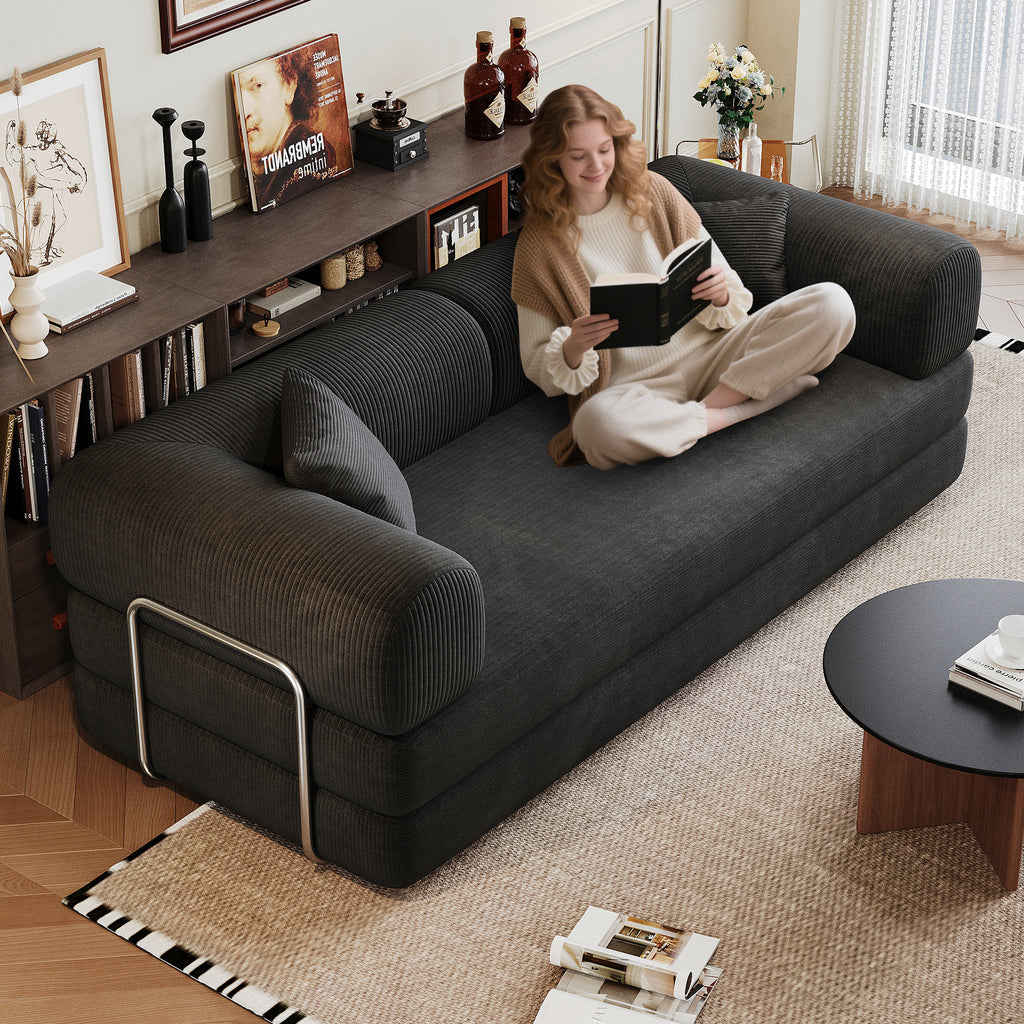 Black corduroy convertible sofa in living room setting