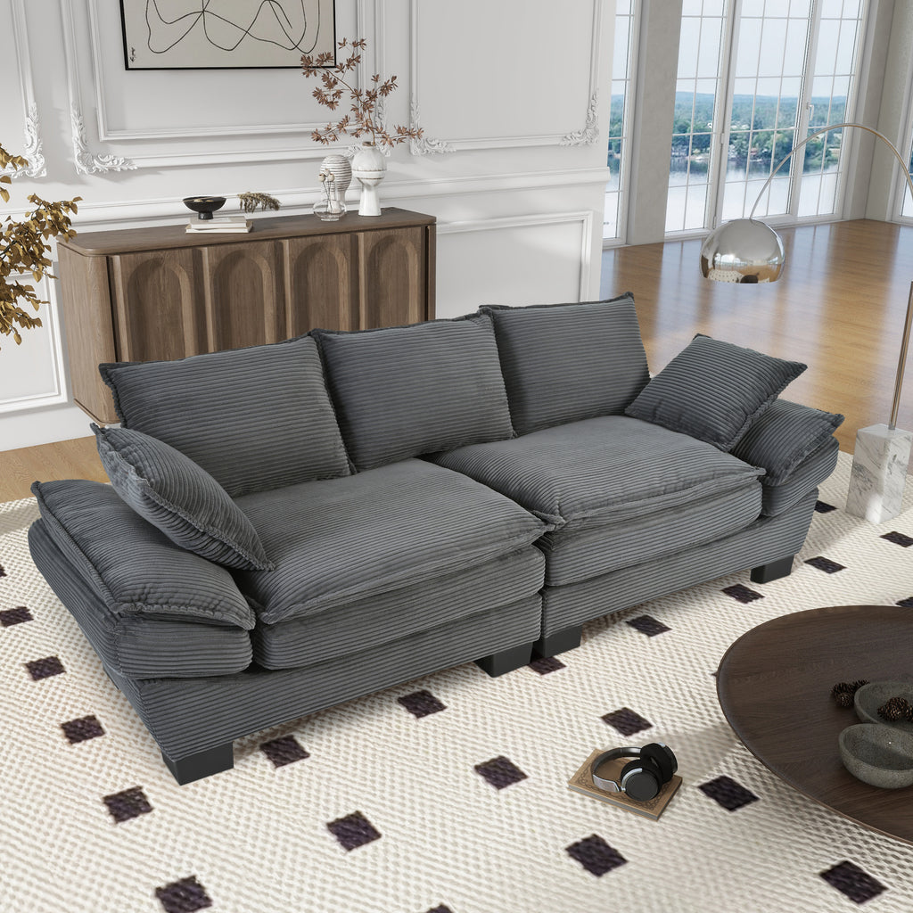 Curved backrest corduroy sofa in living room setting