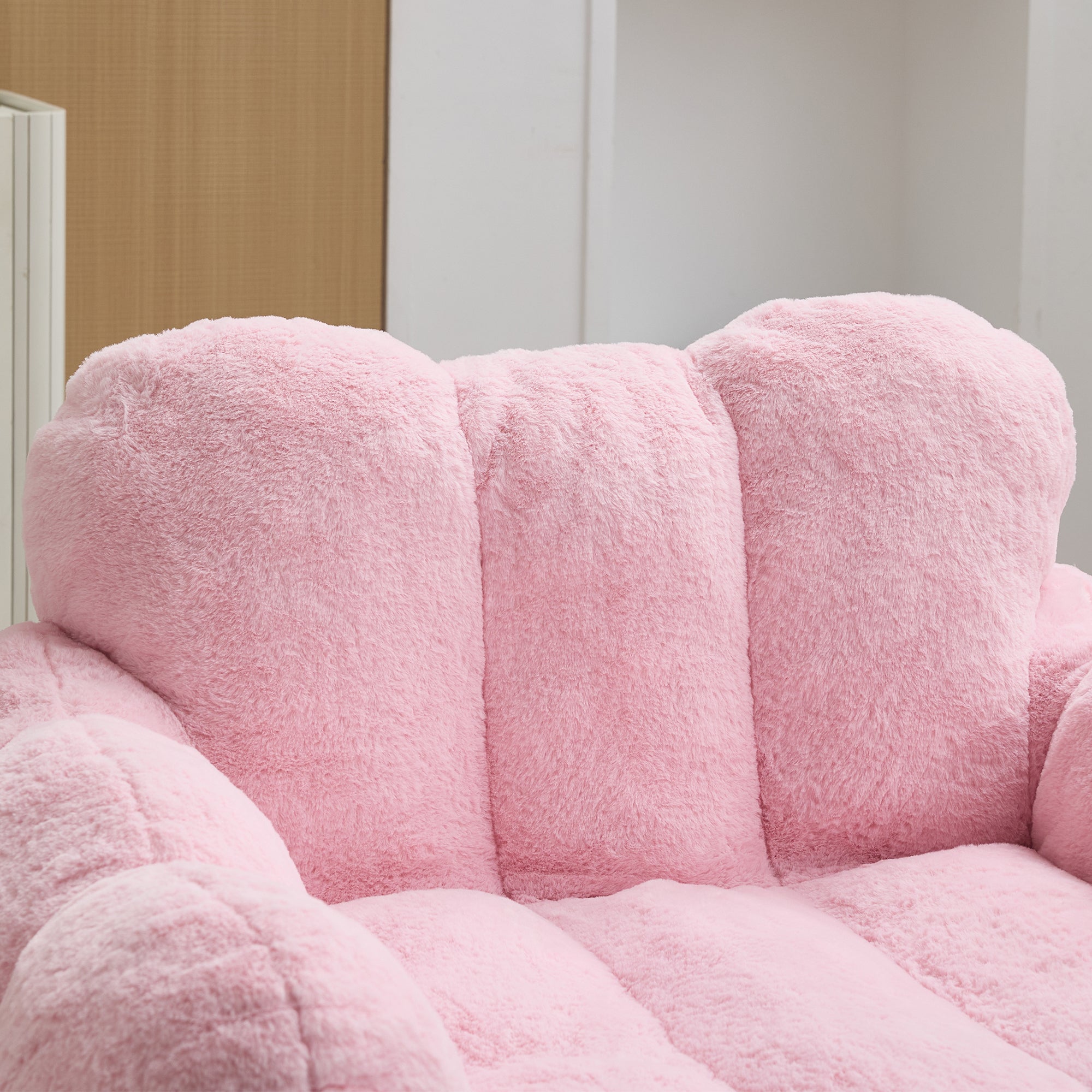 Pink floor chair upholstery texture close-up