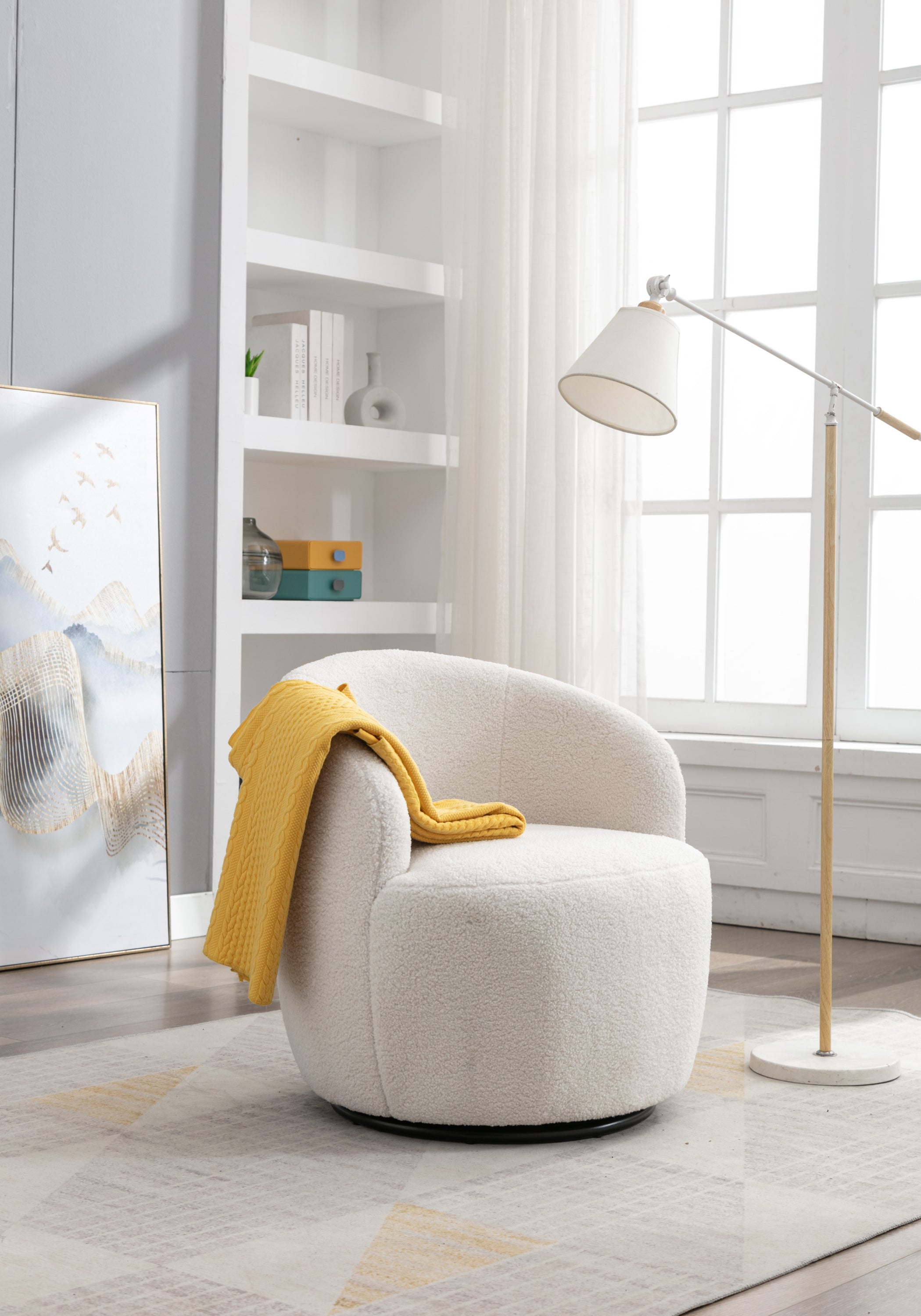 Ivory swivel accent chair with black metal base — angle view