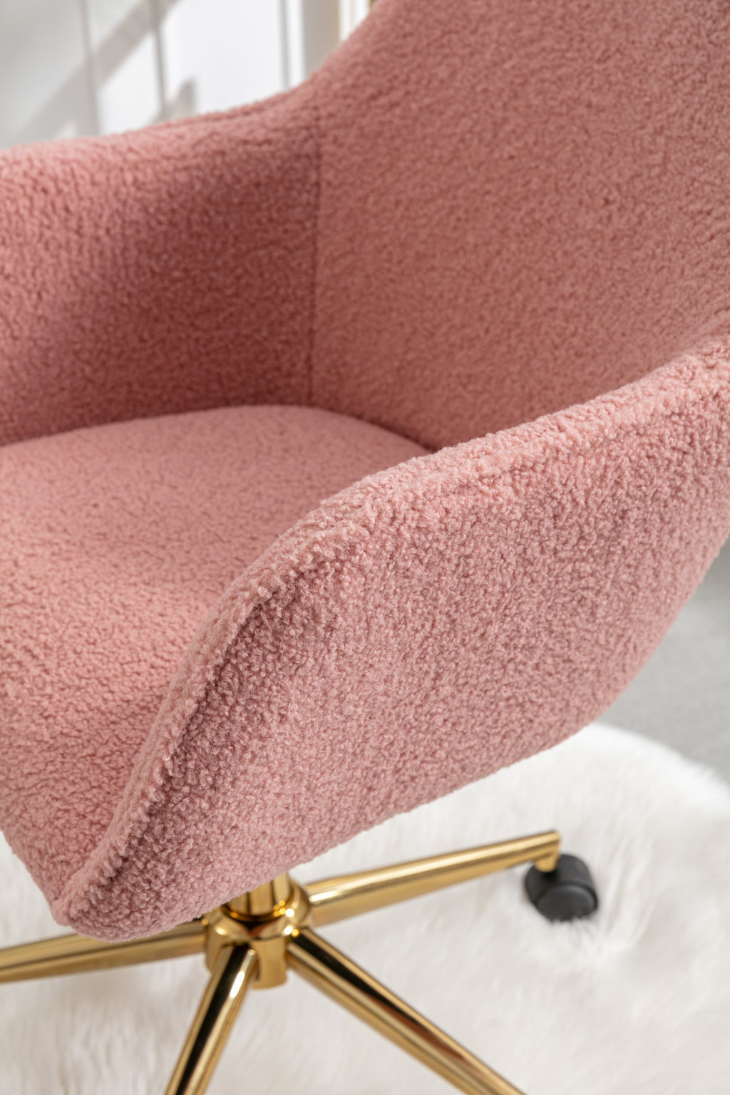 Swivel office chair pink teddy upholstery close-up
