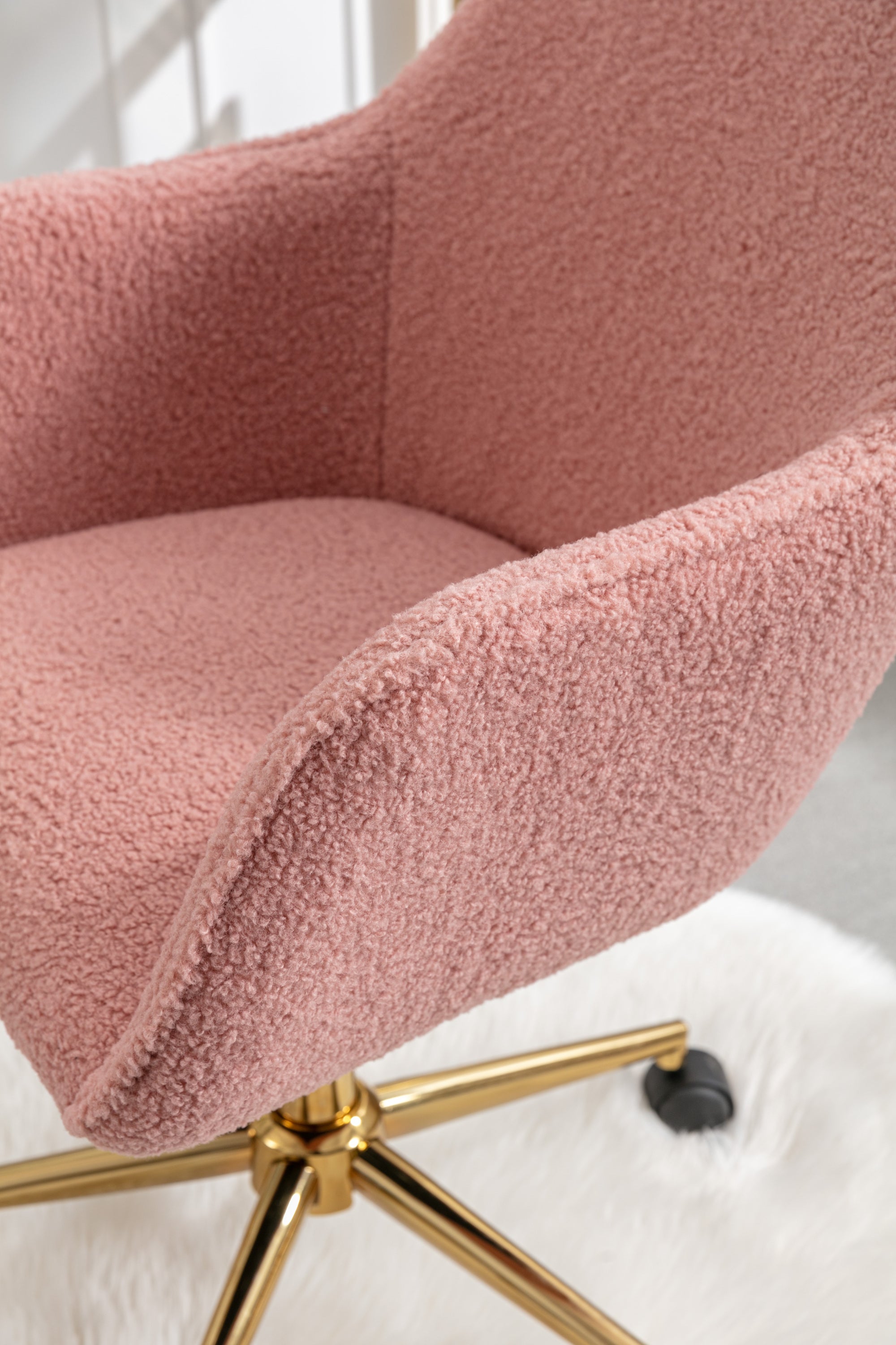 Swivel office chair pink teddy upholstery close-up