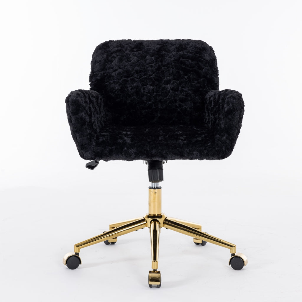Reclining black desk chair with gold metal legs and wheels
