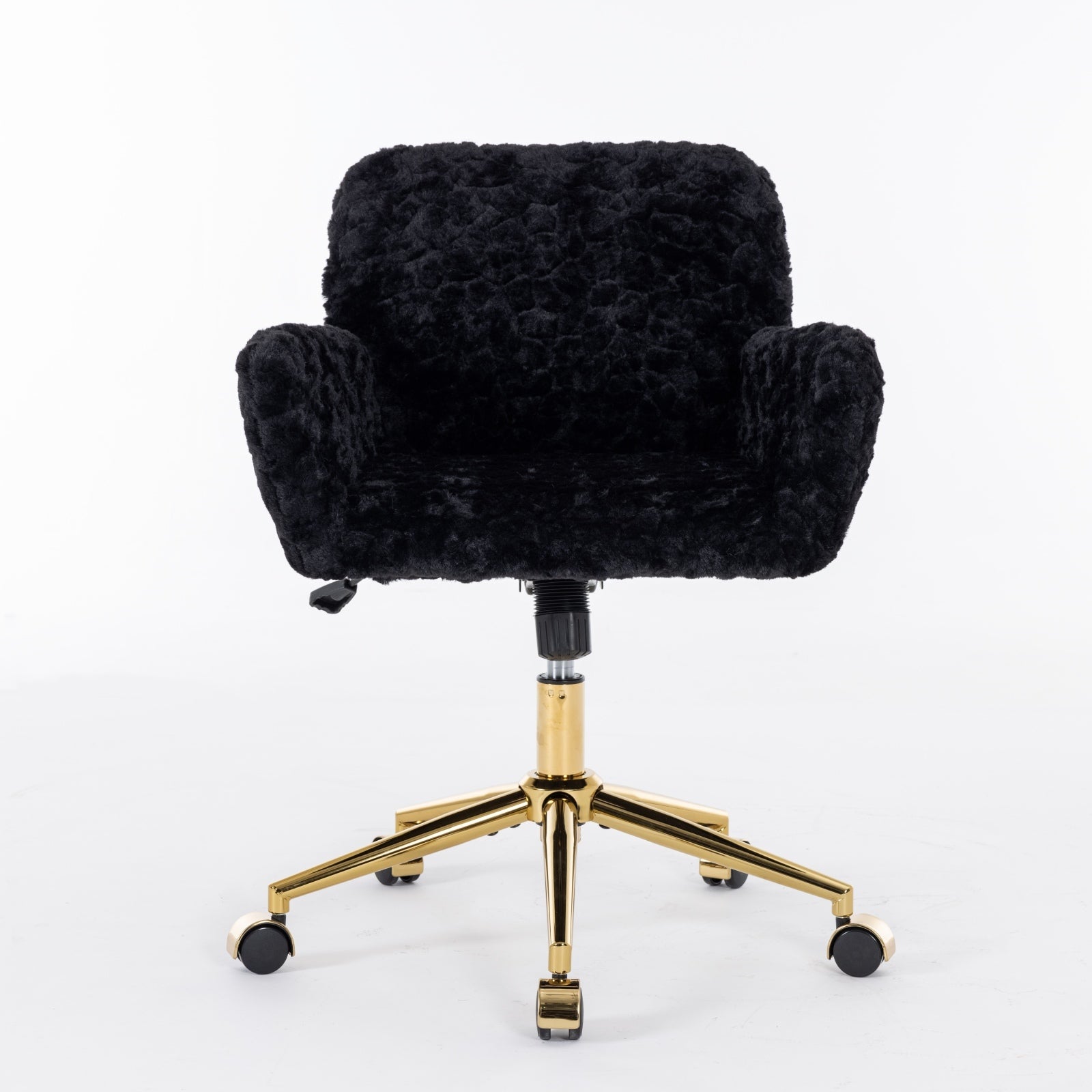 Reclining black desk chair with gold metal legs and wheels