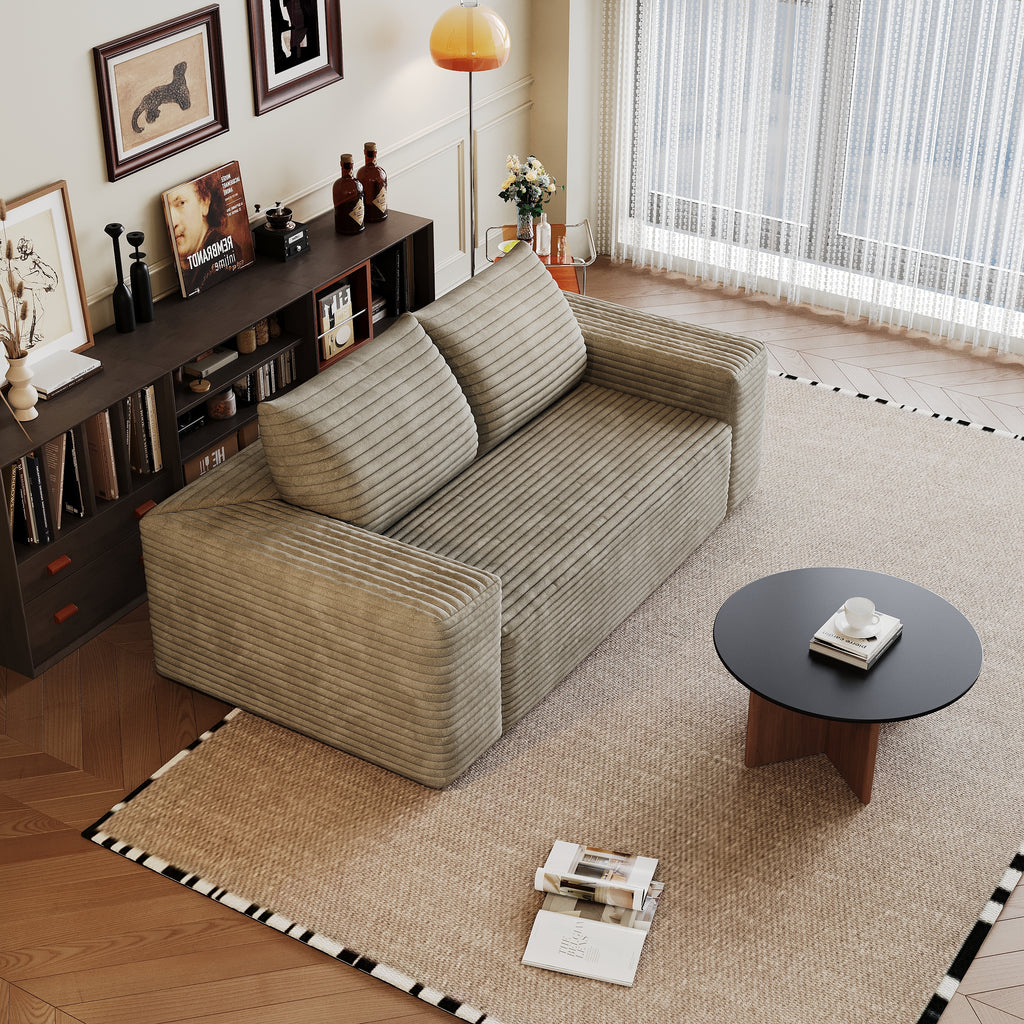 Camel corduroy sofa seating area and cushions