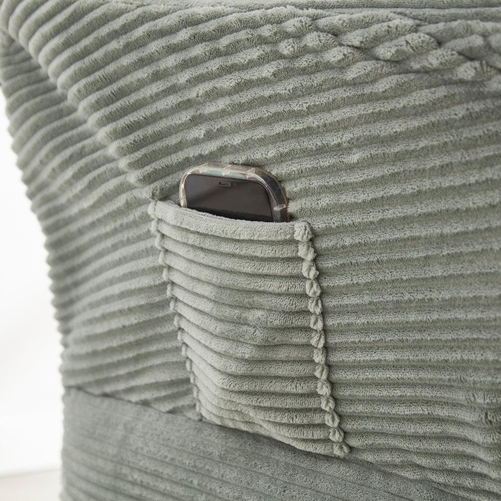 Light green accent chair with side storage pocket